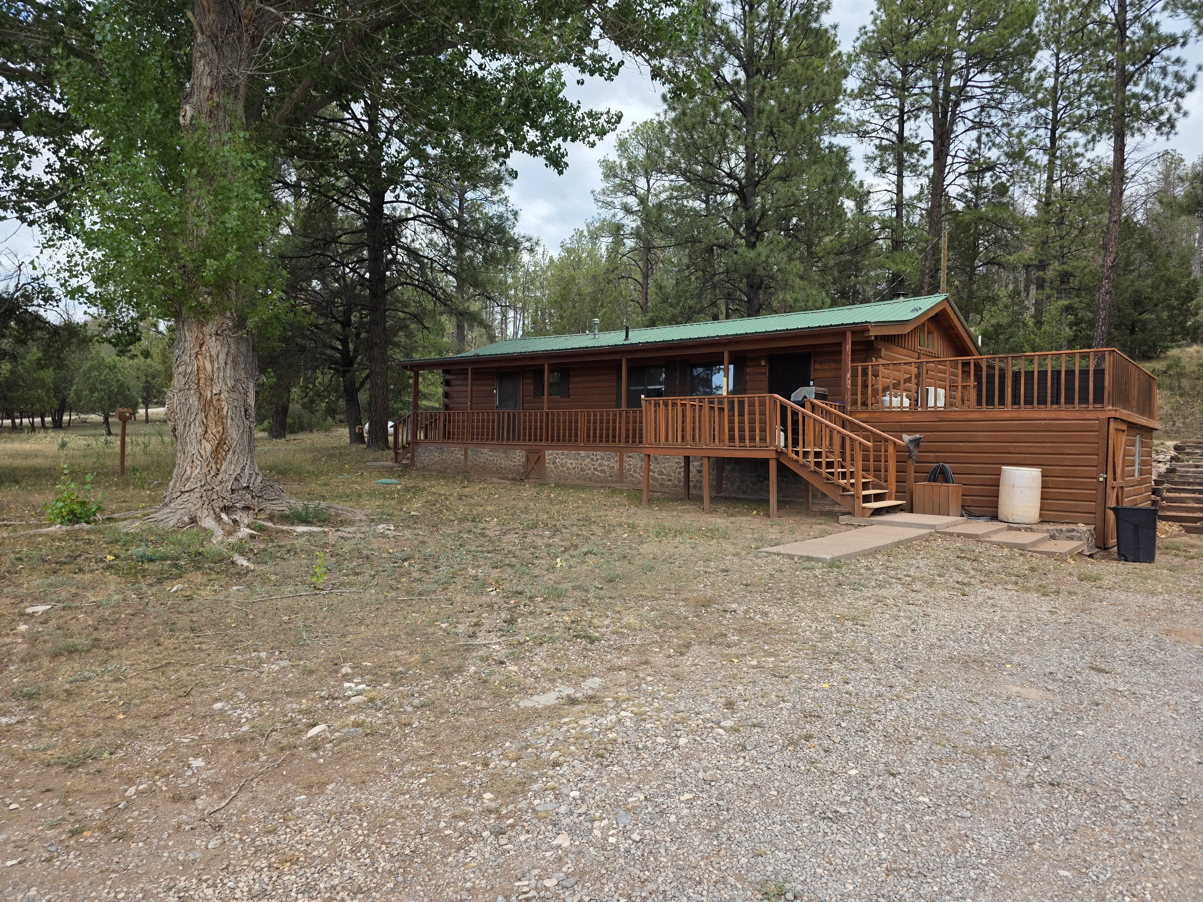 log cabin front with deck