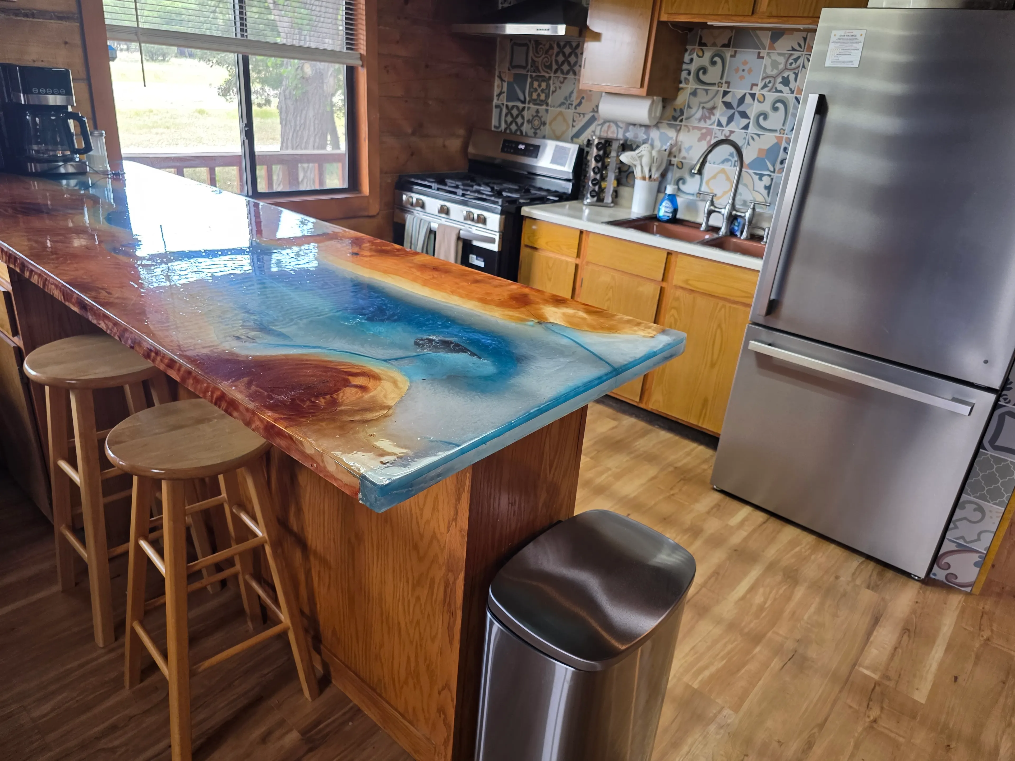 Kitchen with epoxy river bar top