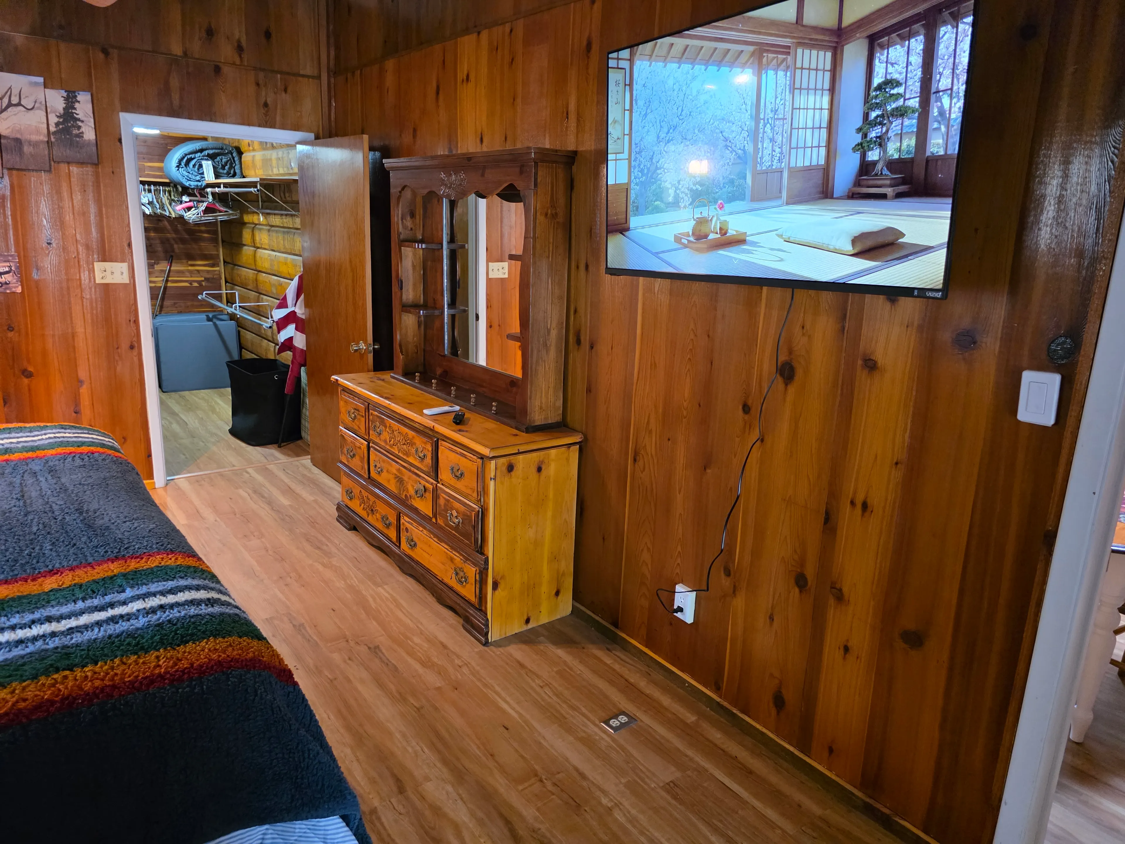 Bedroom TV, dresser, closet doorway