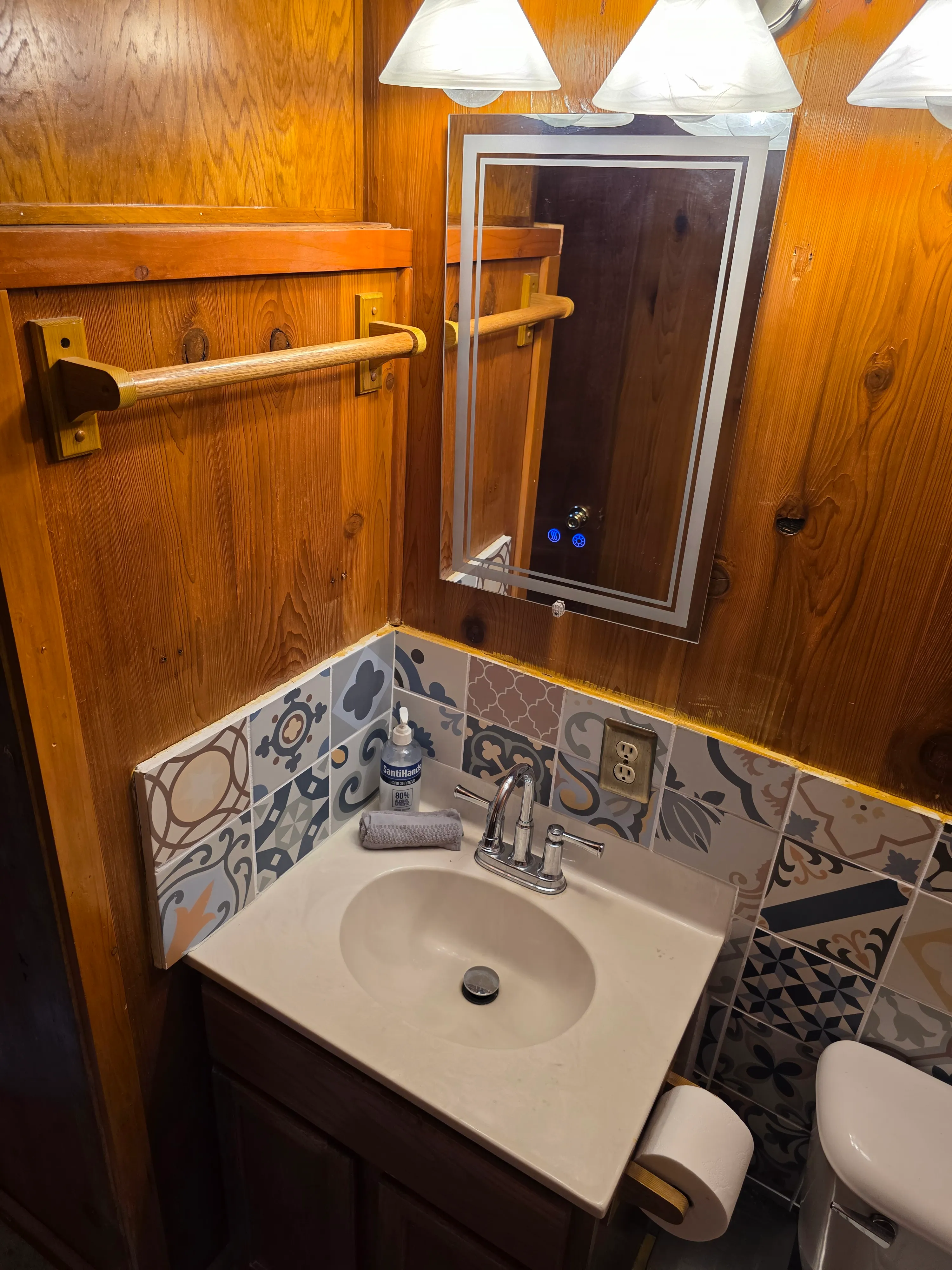 vanity sink with lit mirror