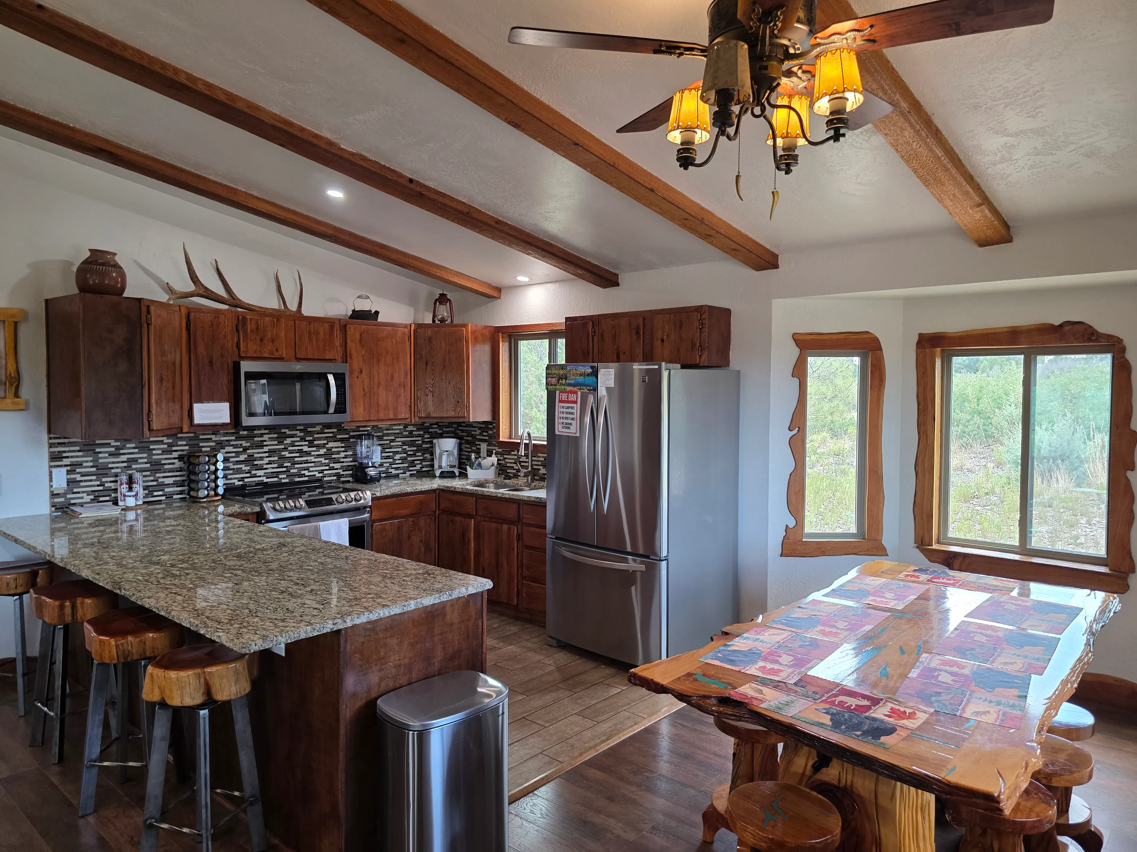 full kitchen with granite breakfast bar