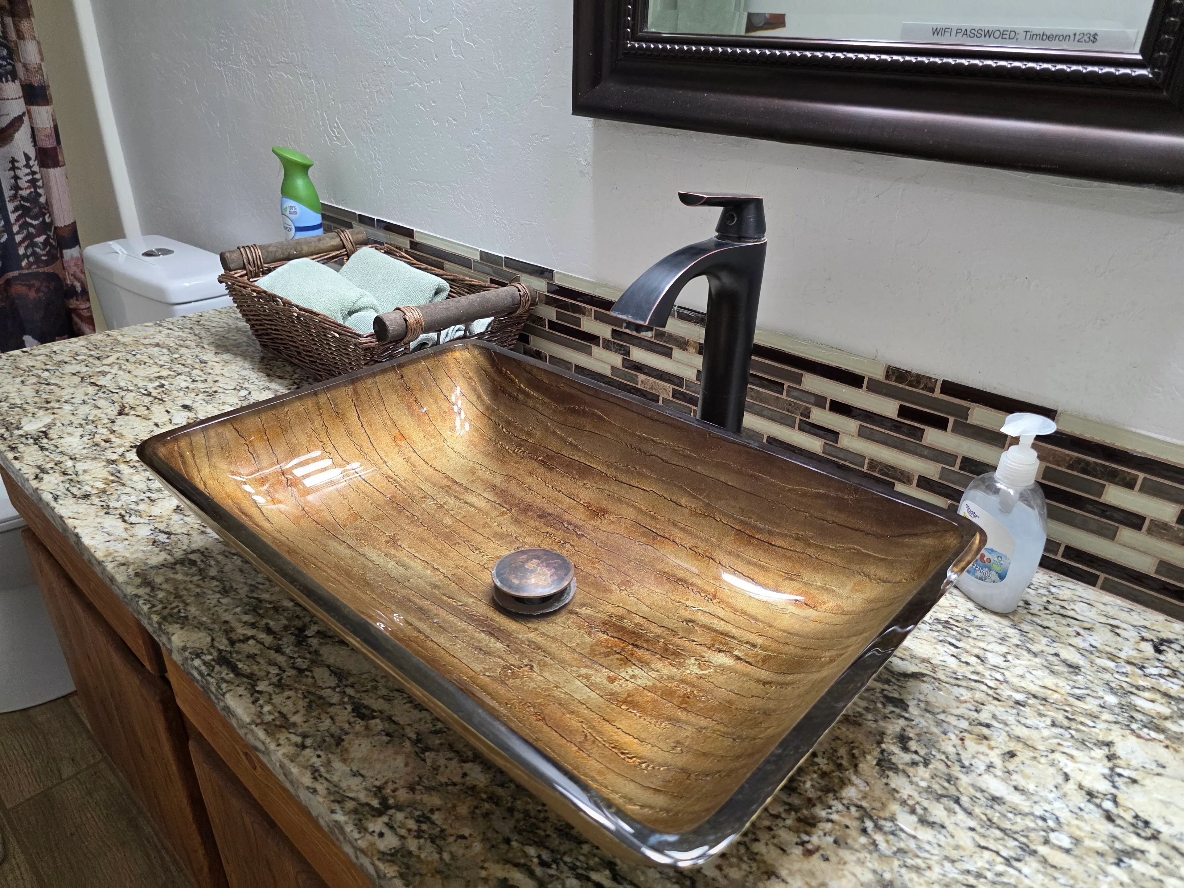 vessel sink, wifi sign mirrored