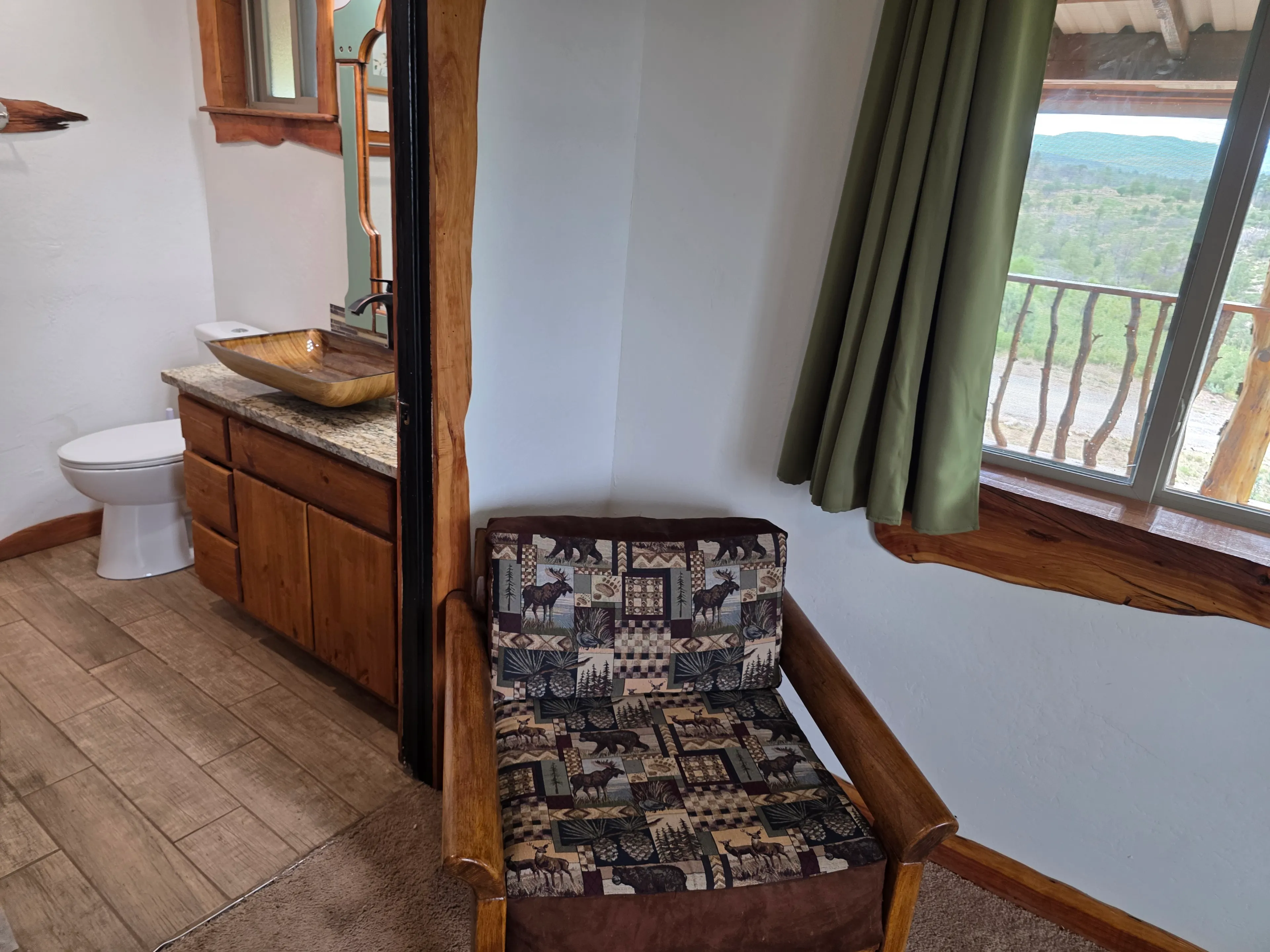 Ensuite bathroom beside bedroom chair
