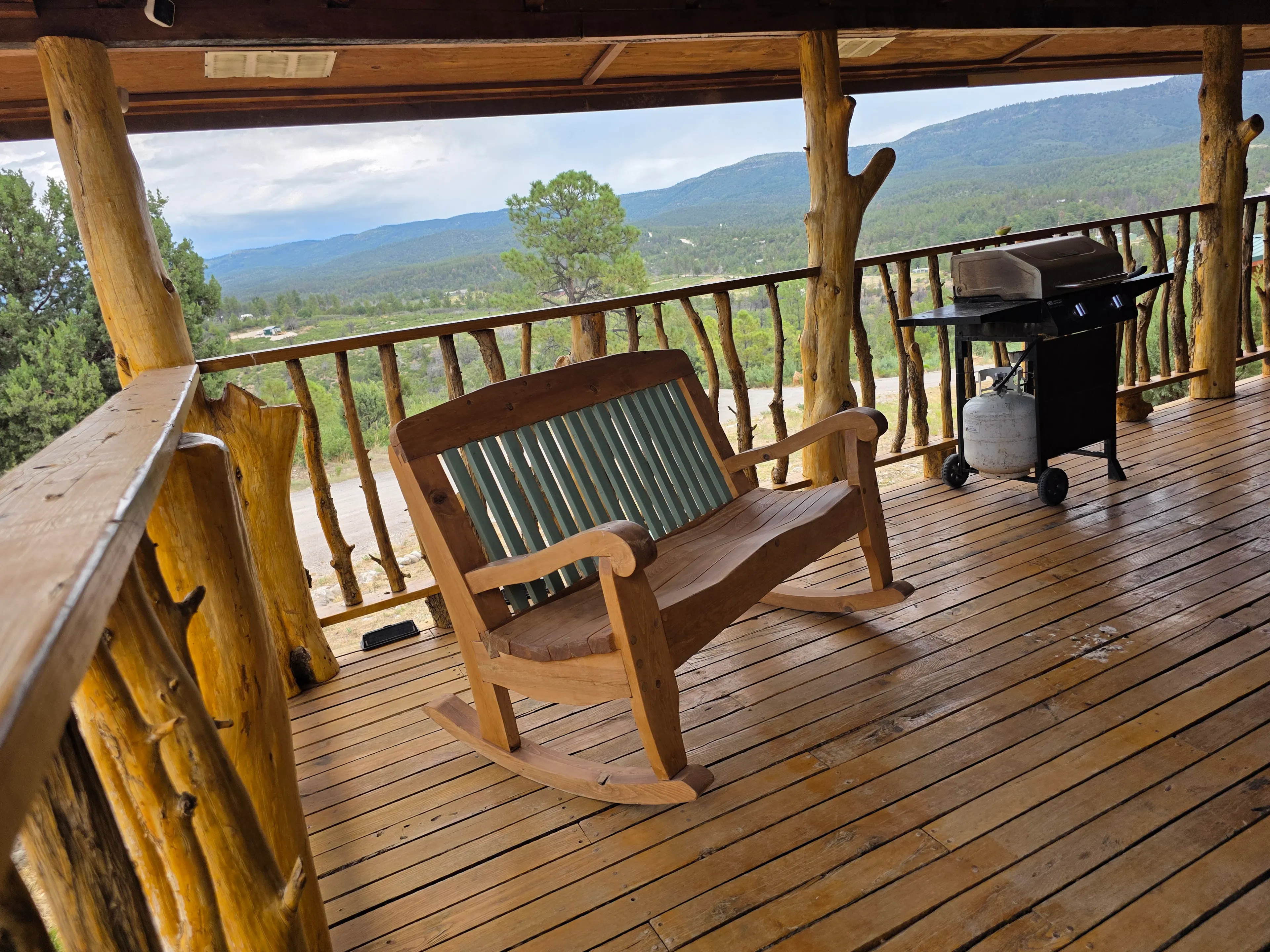 Deck rocking bench, grill, view