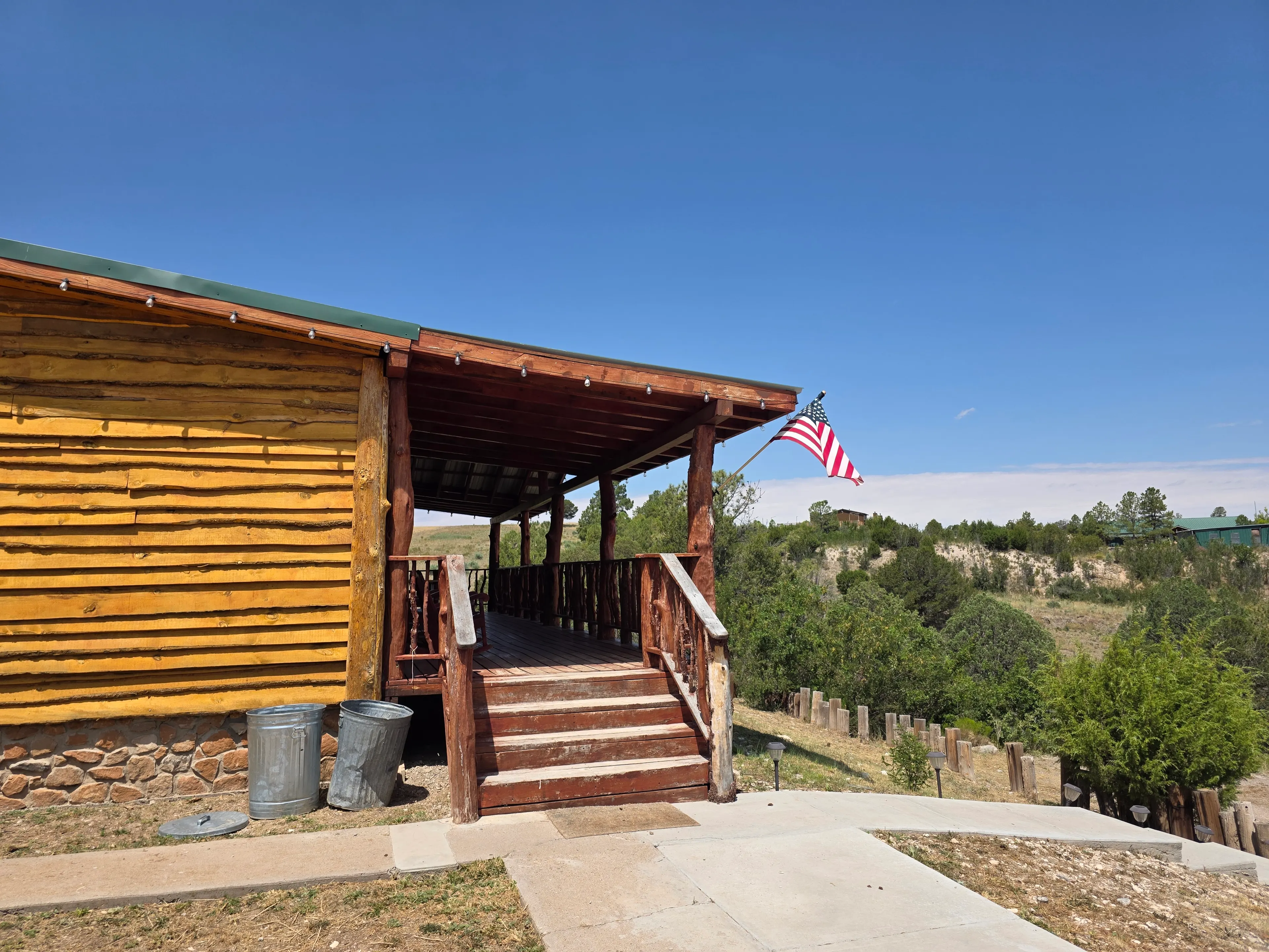 Cabin exterior, deck stairs, flag