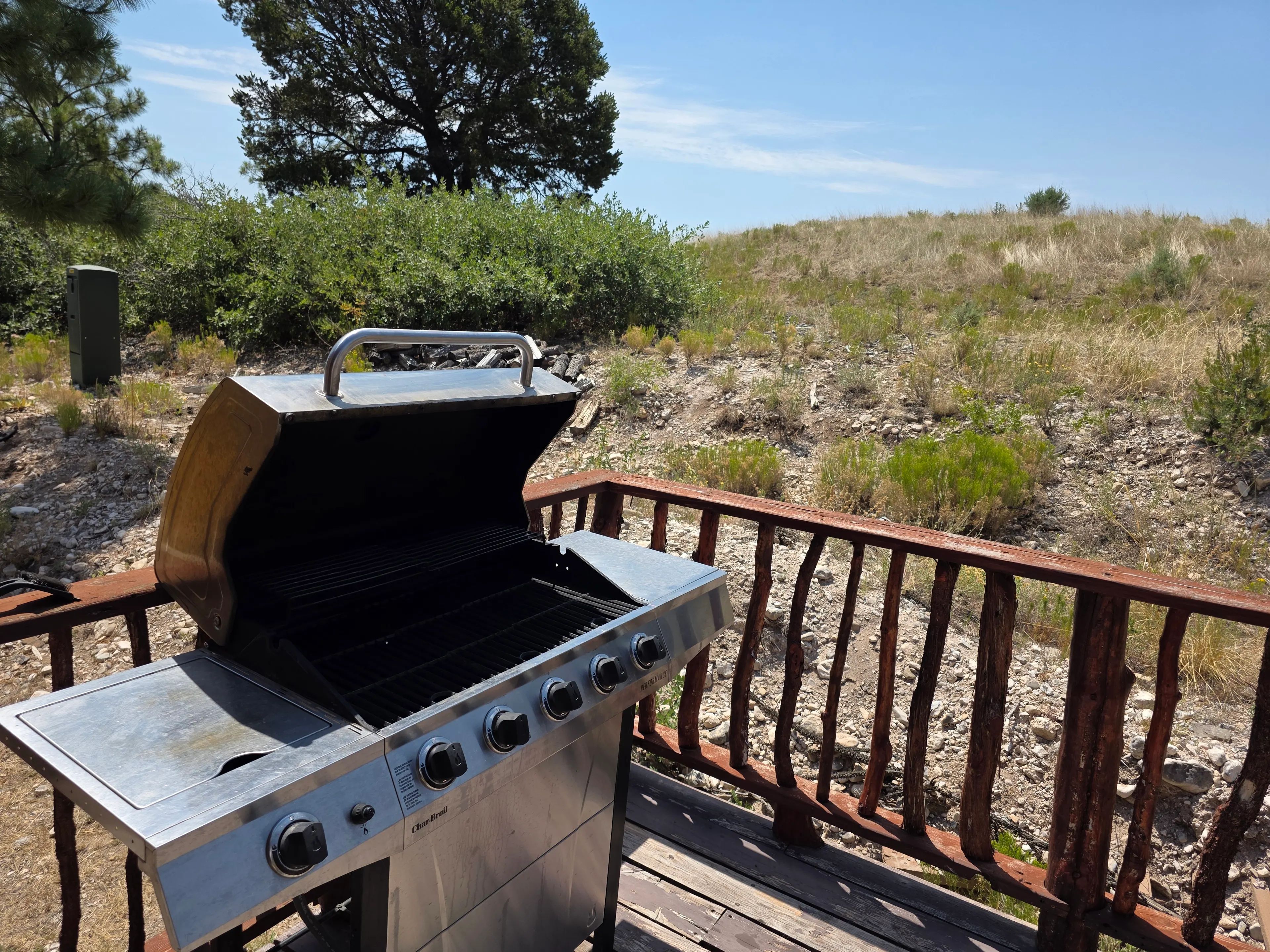 Gas grill open on deck