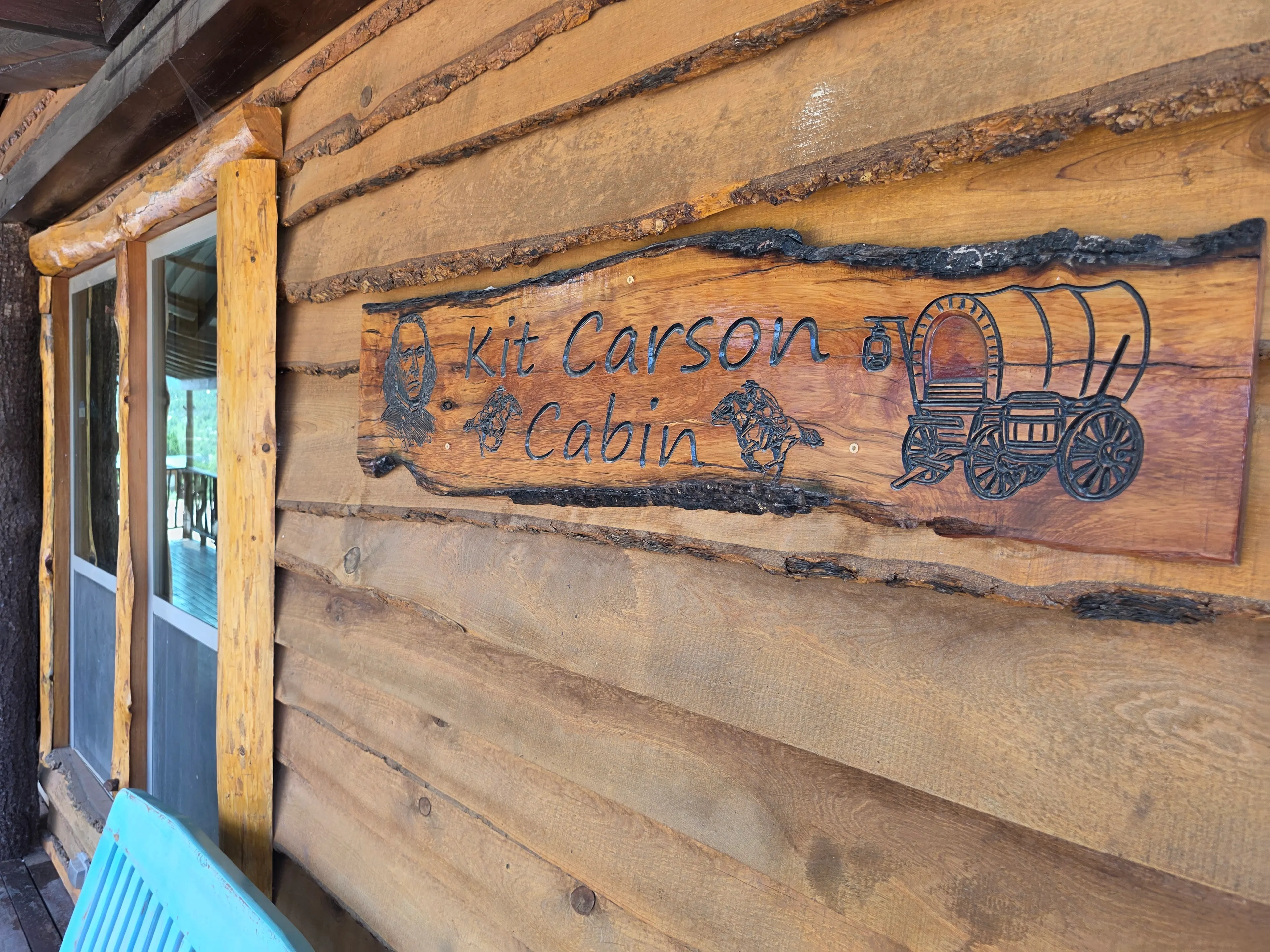 Carved Kit Carson Cabin sign