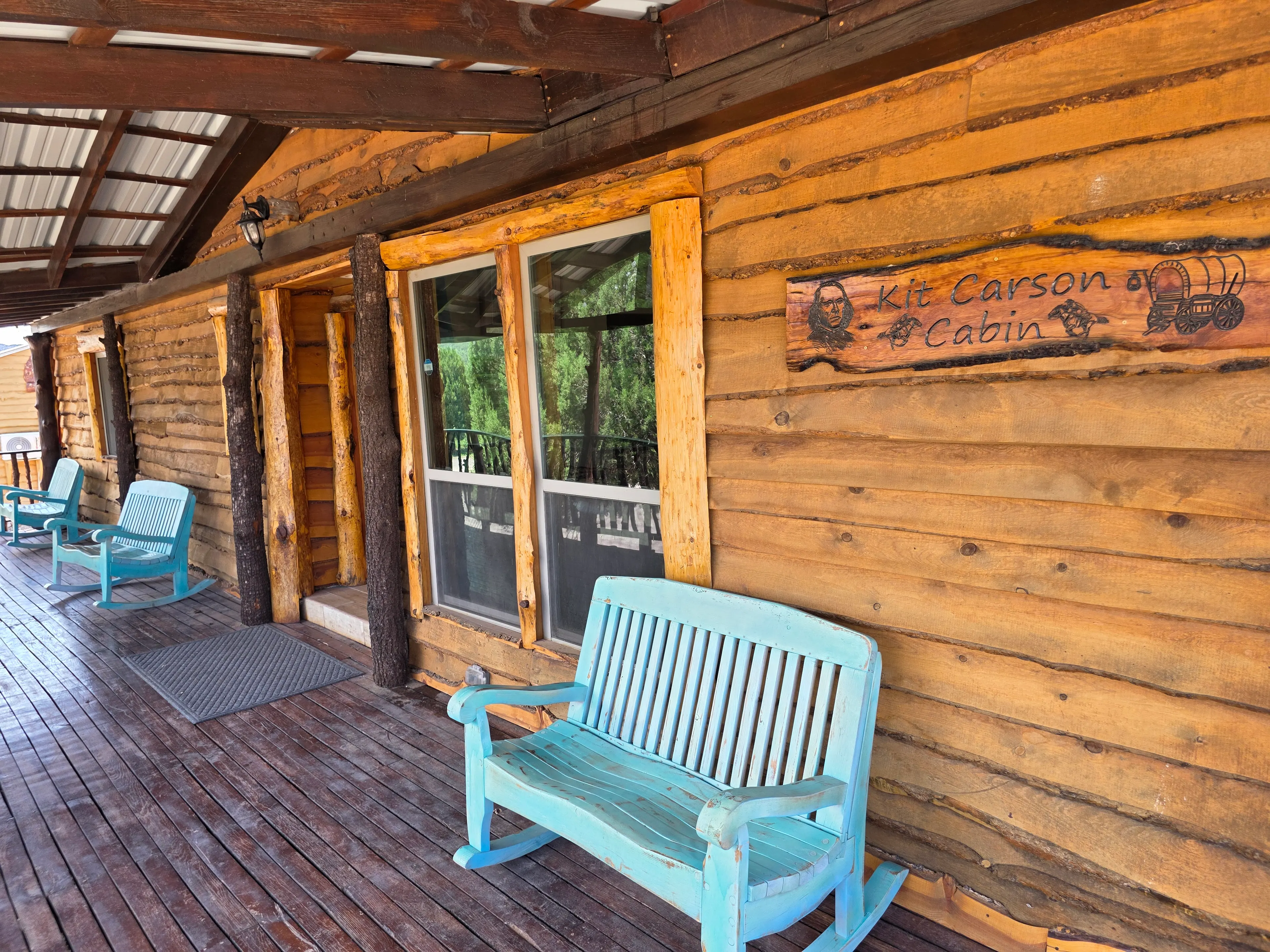 Porch rockers, cabin name sign