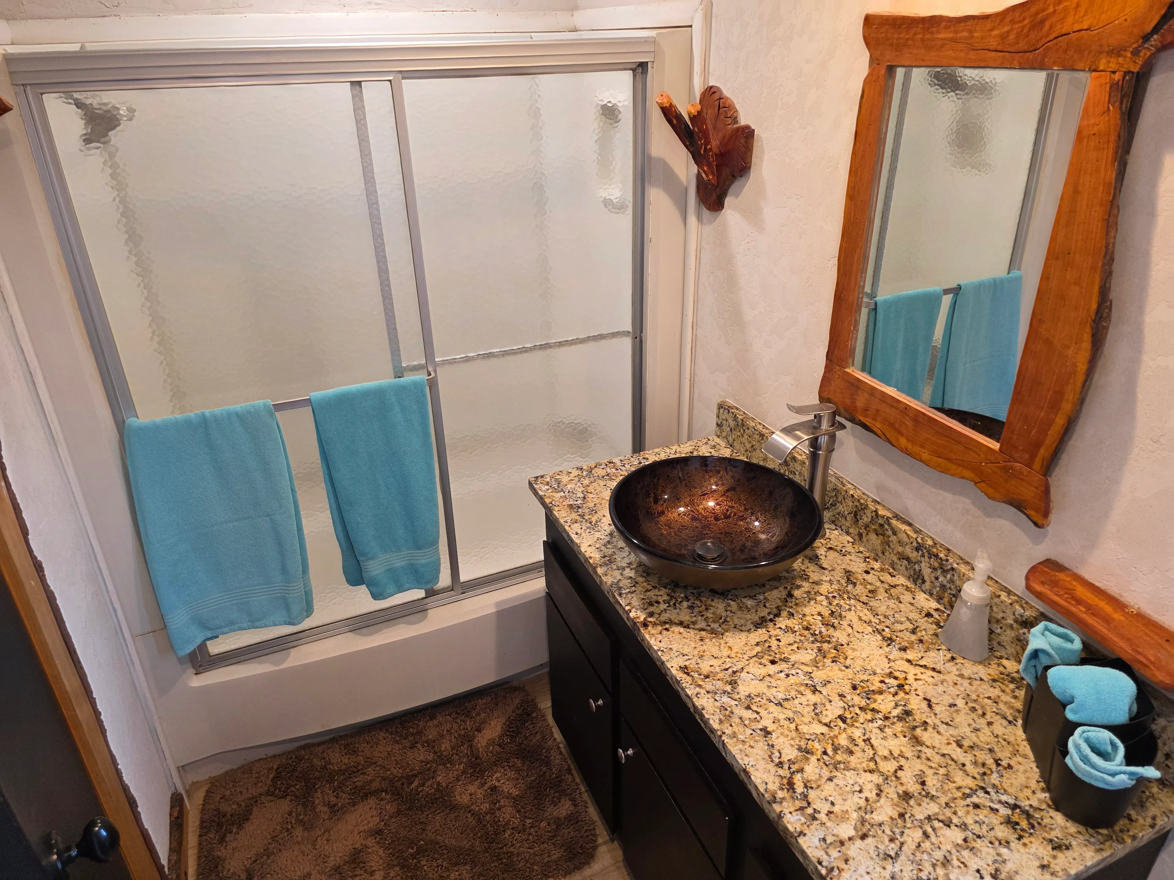 Shower, granite vanity, vessel sink