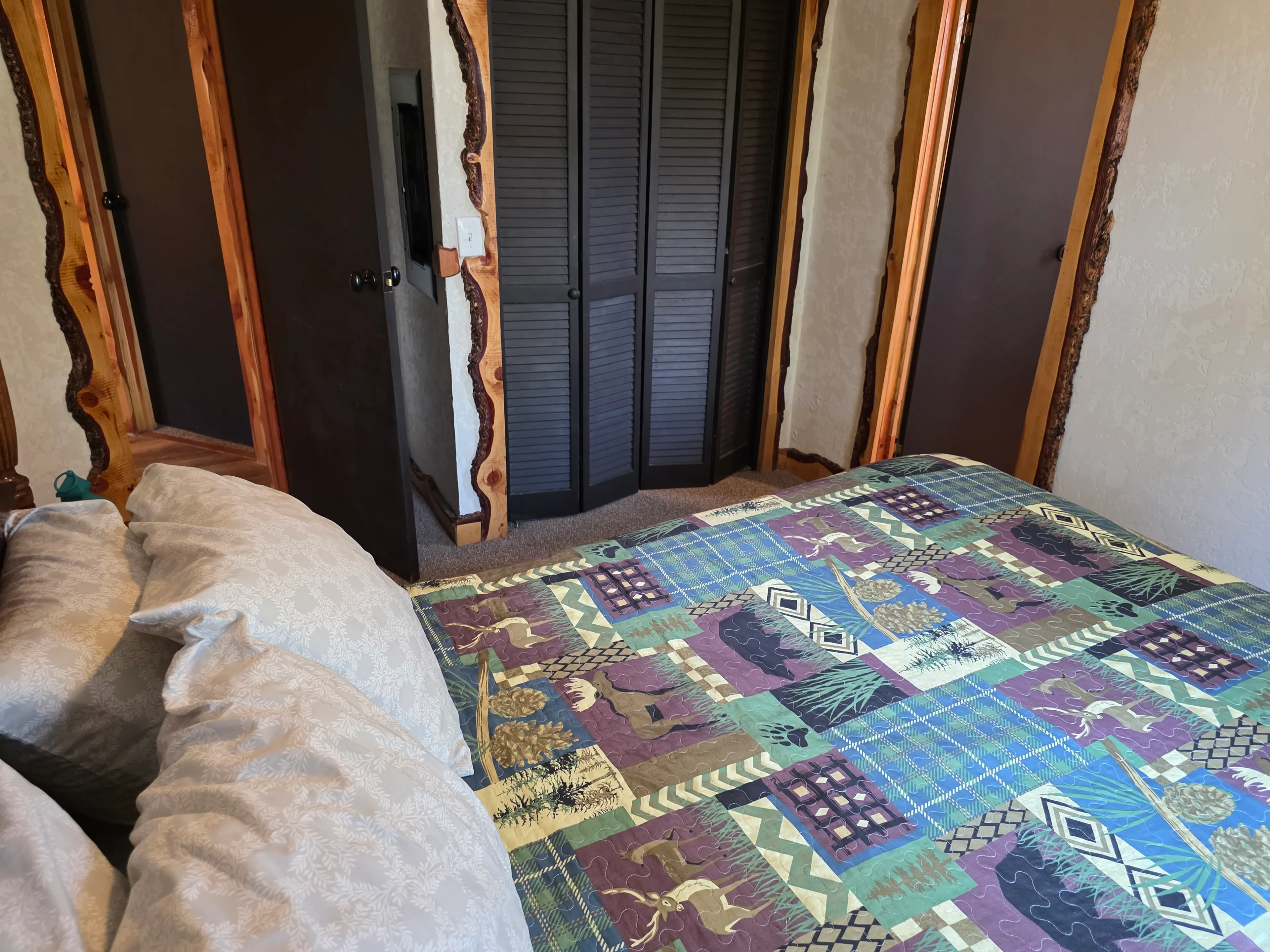 Bedroom closet doors and bed
