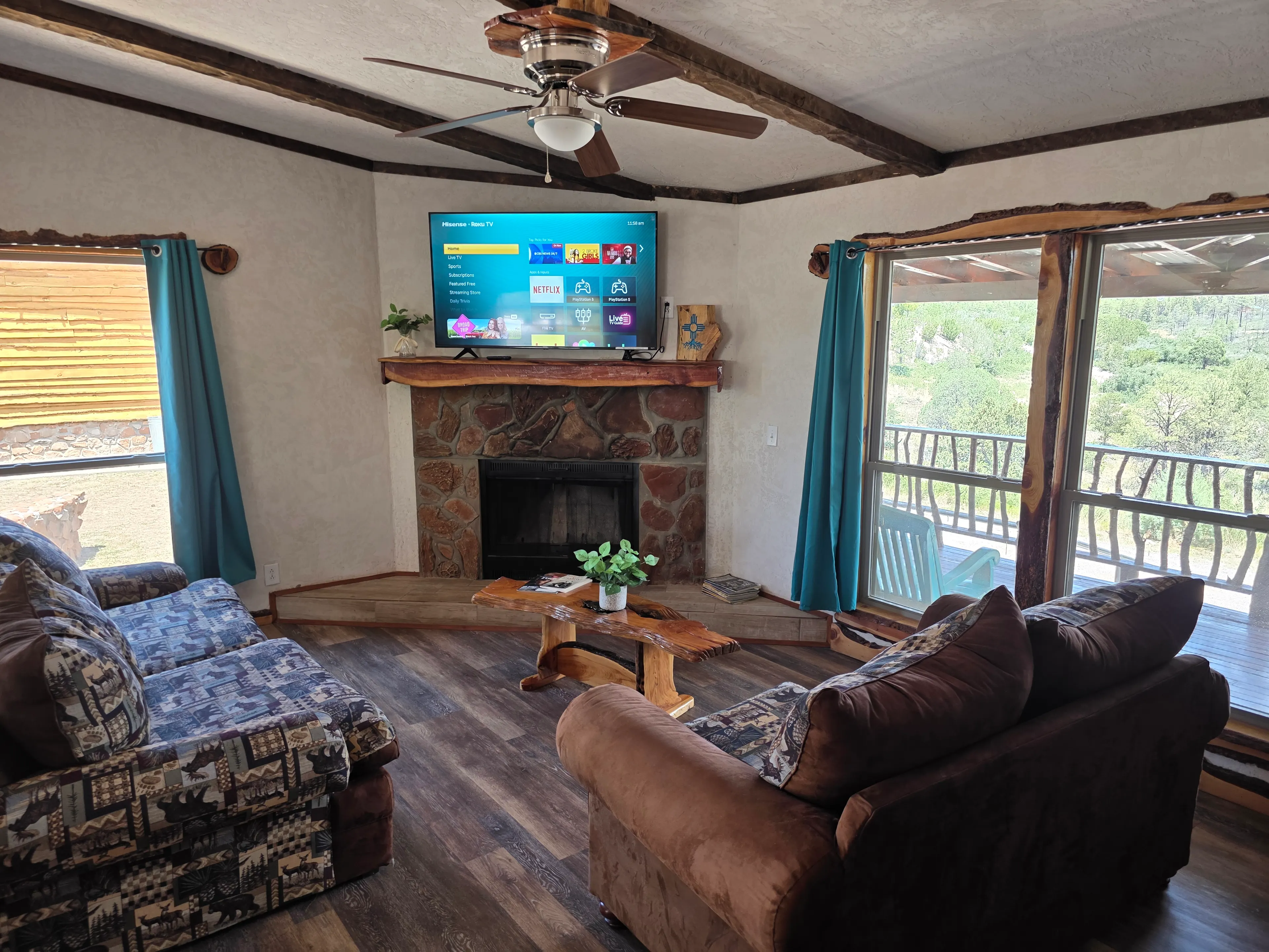 TV over fireplace, two sofas