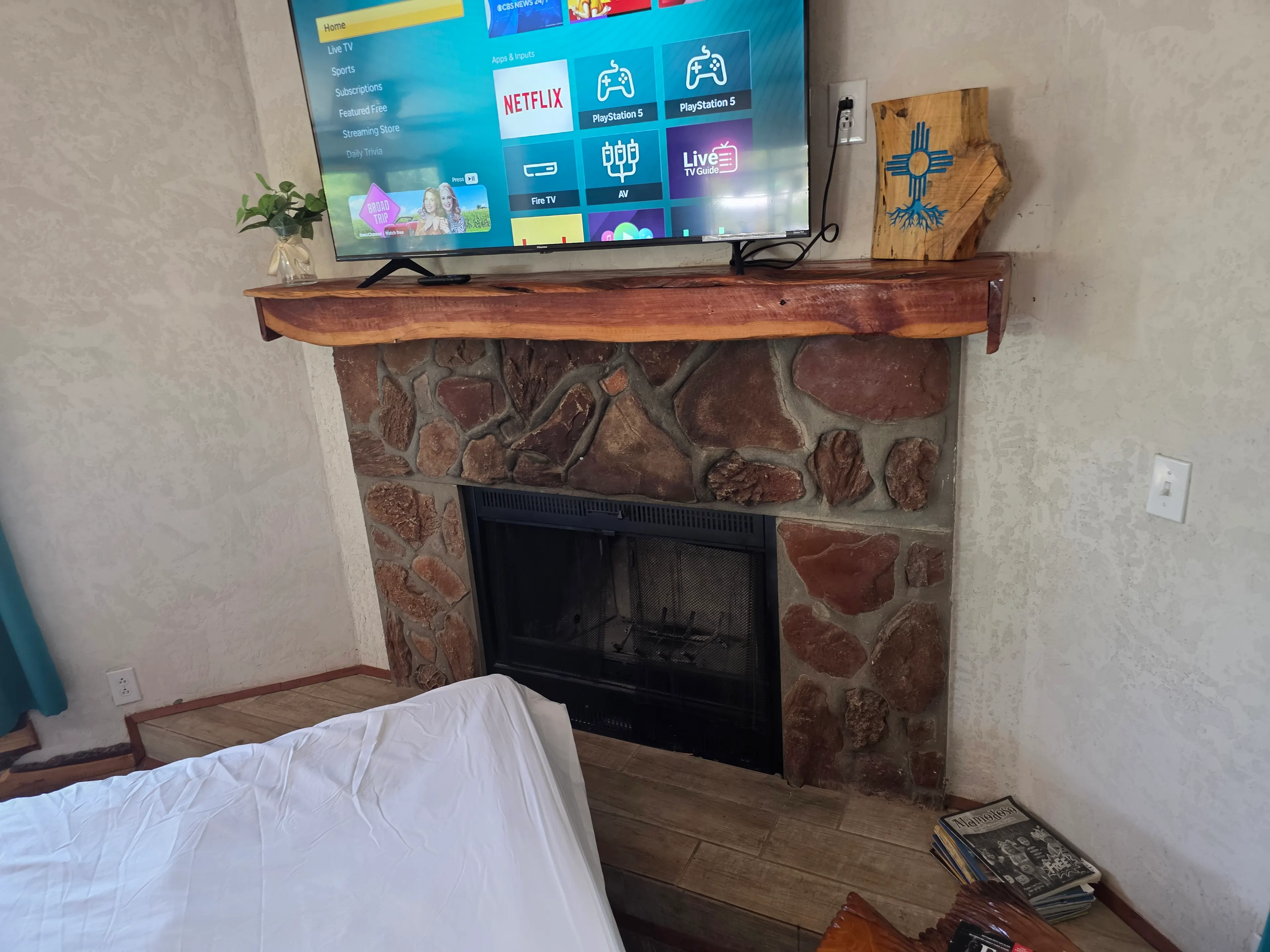 stone fireplace and TV mantel closeup