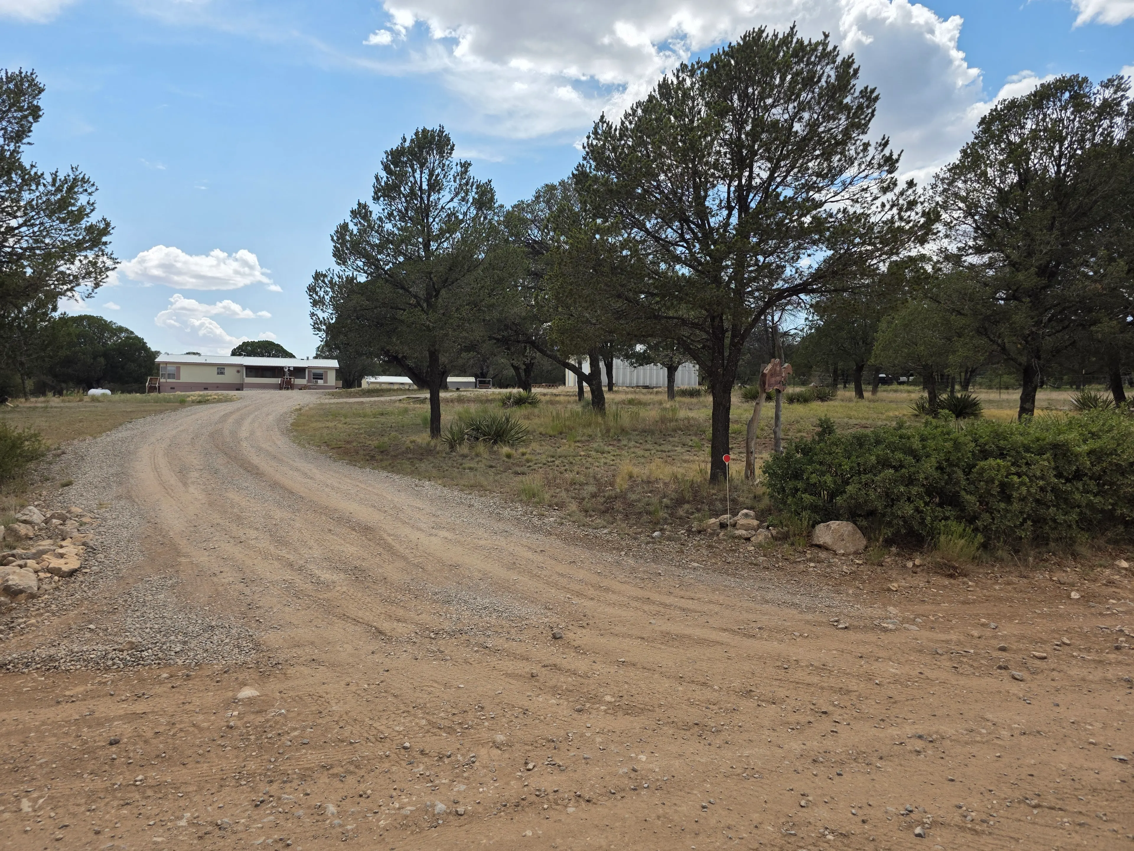 Gravel driveway approach to house