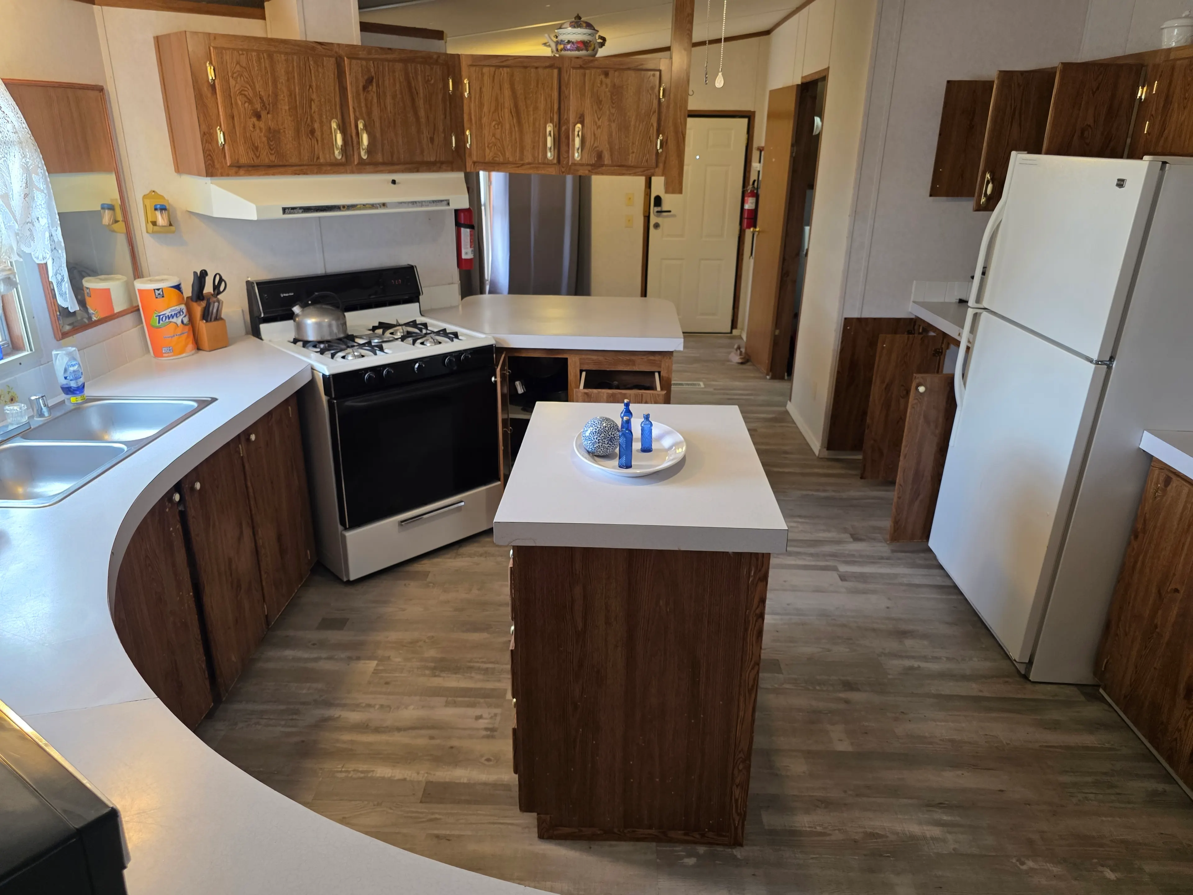 Kitchen with stove, fridge, island