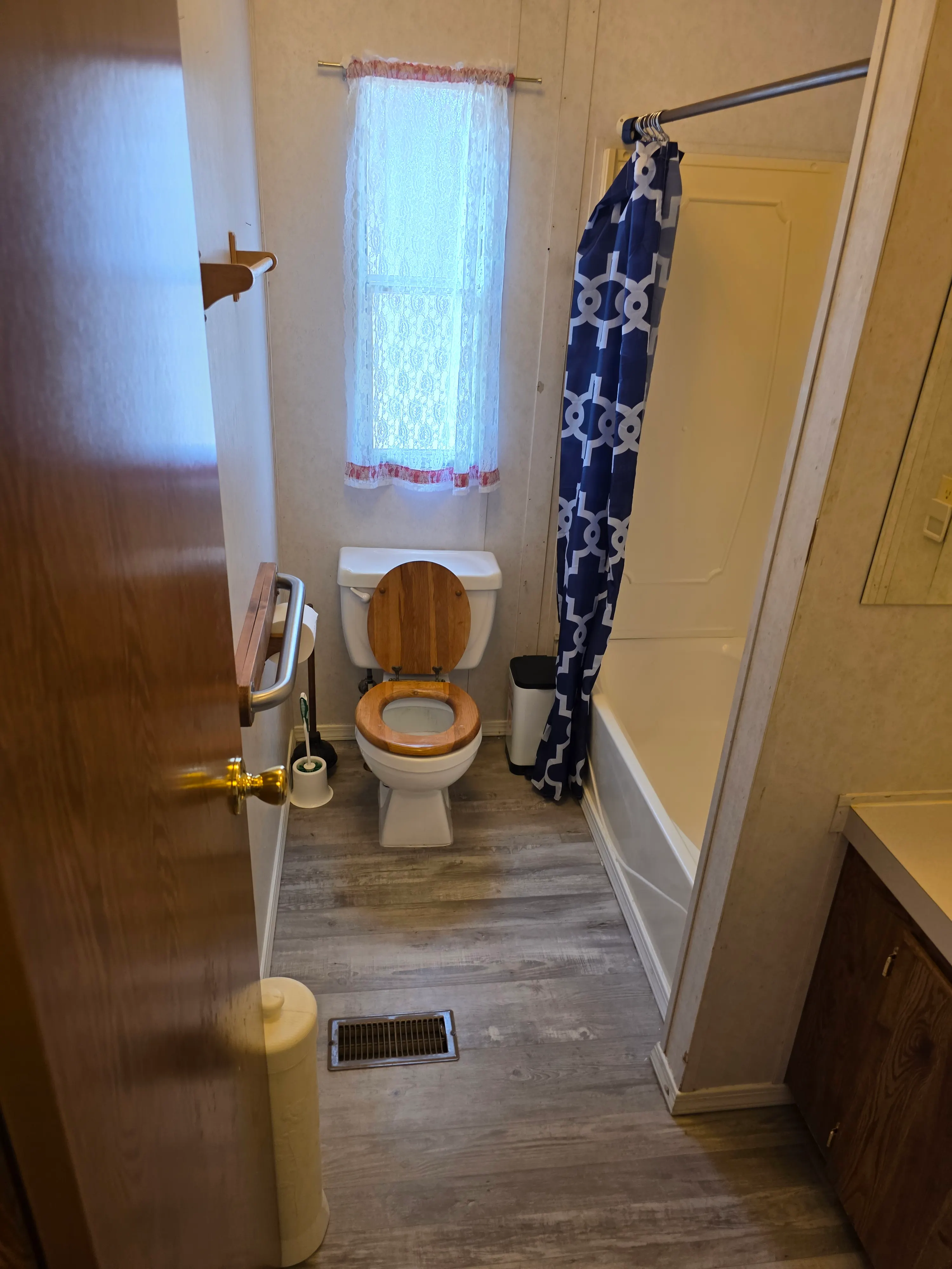 Bathroom with tub-shower and toilet