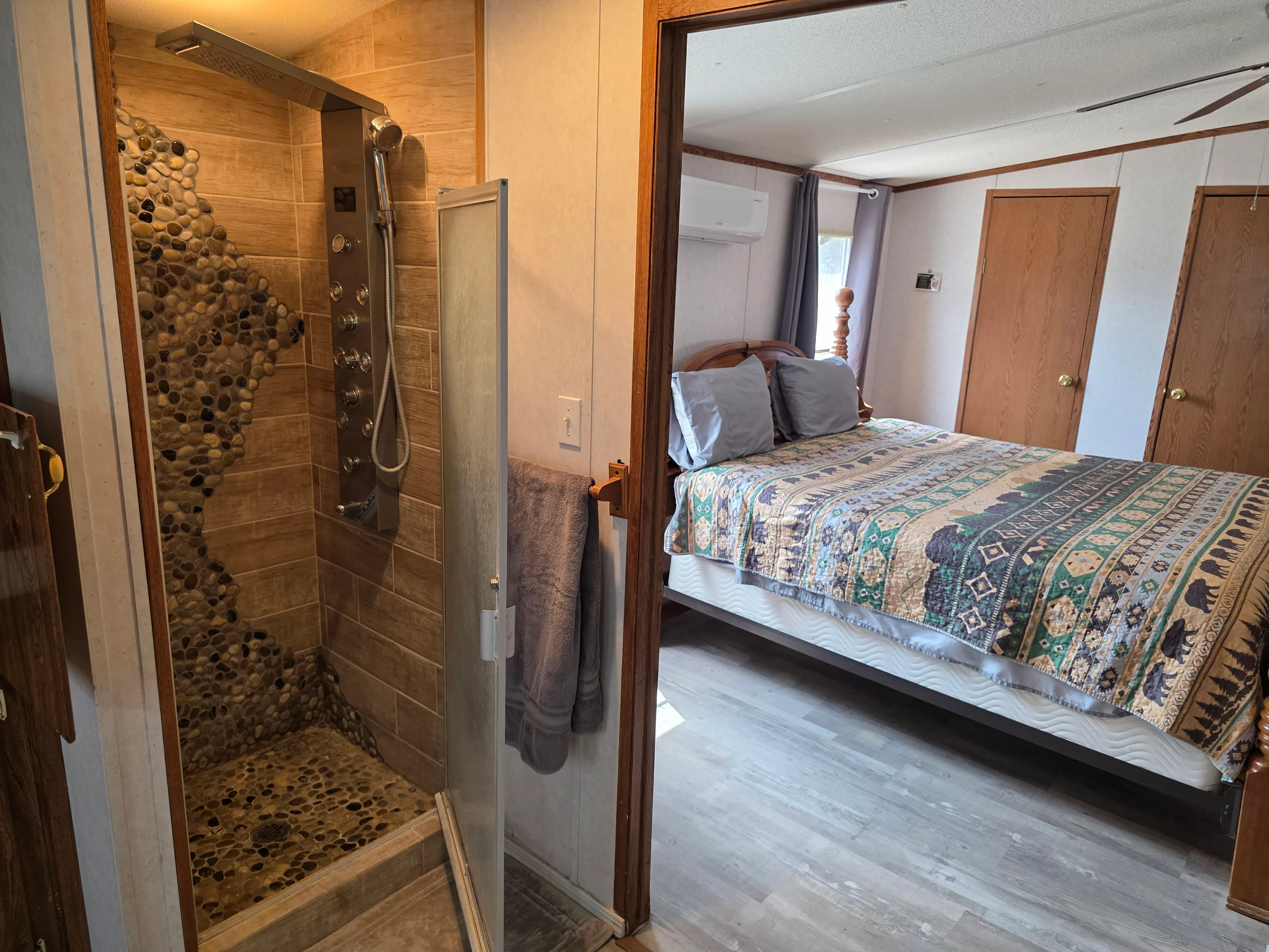 Shower with bedroom view beyond