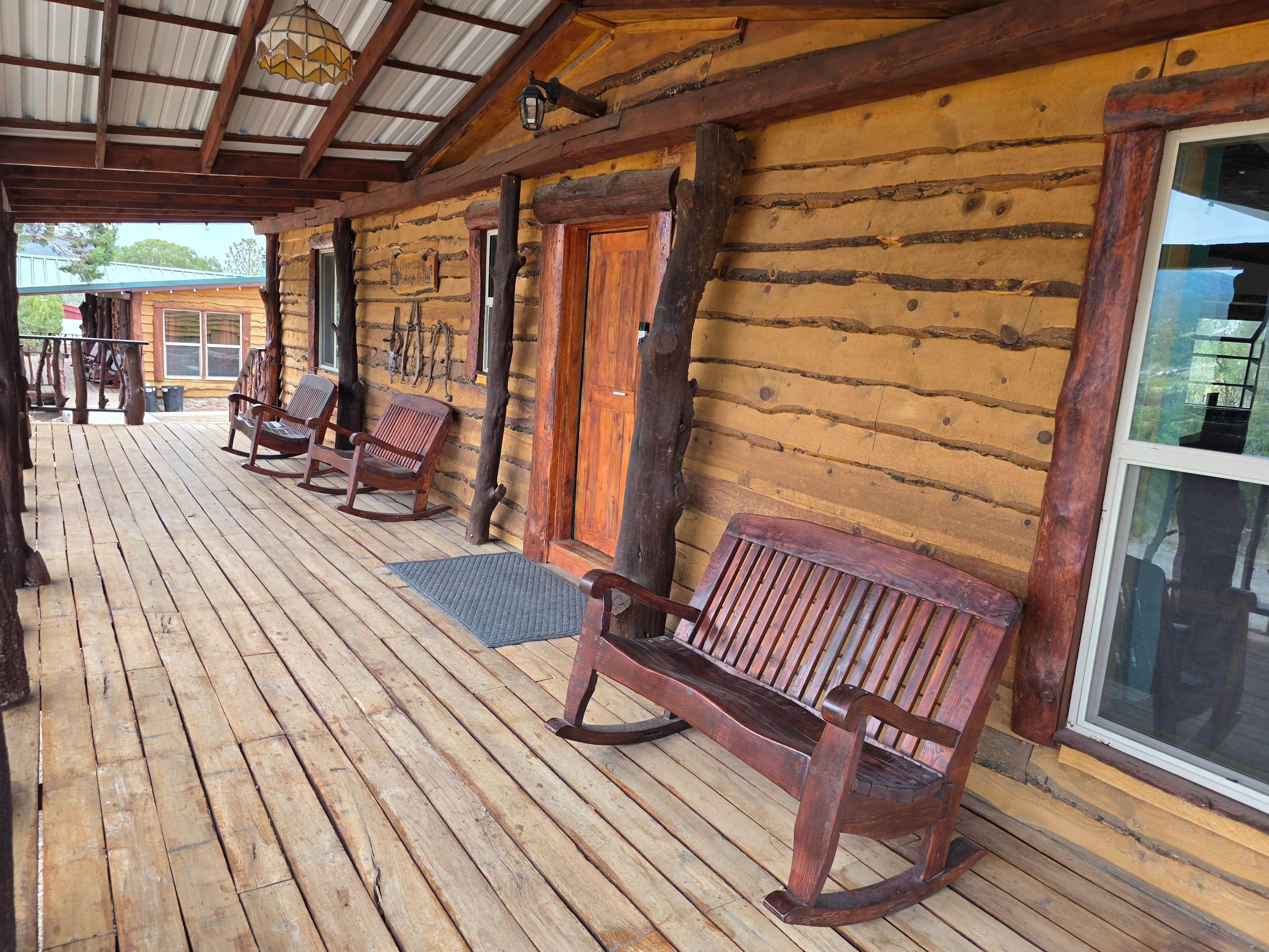 Log cabin porch, rocking chairs