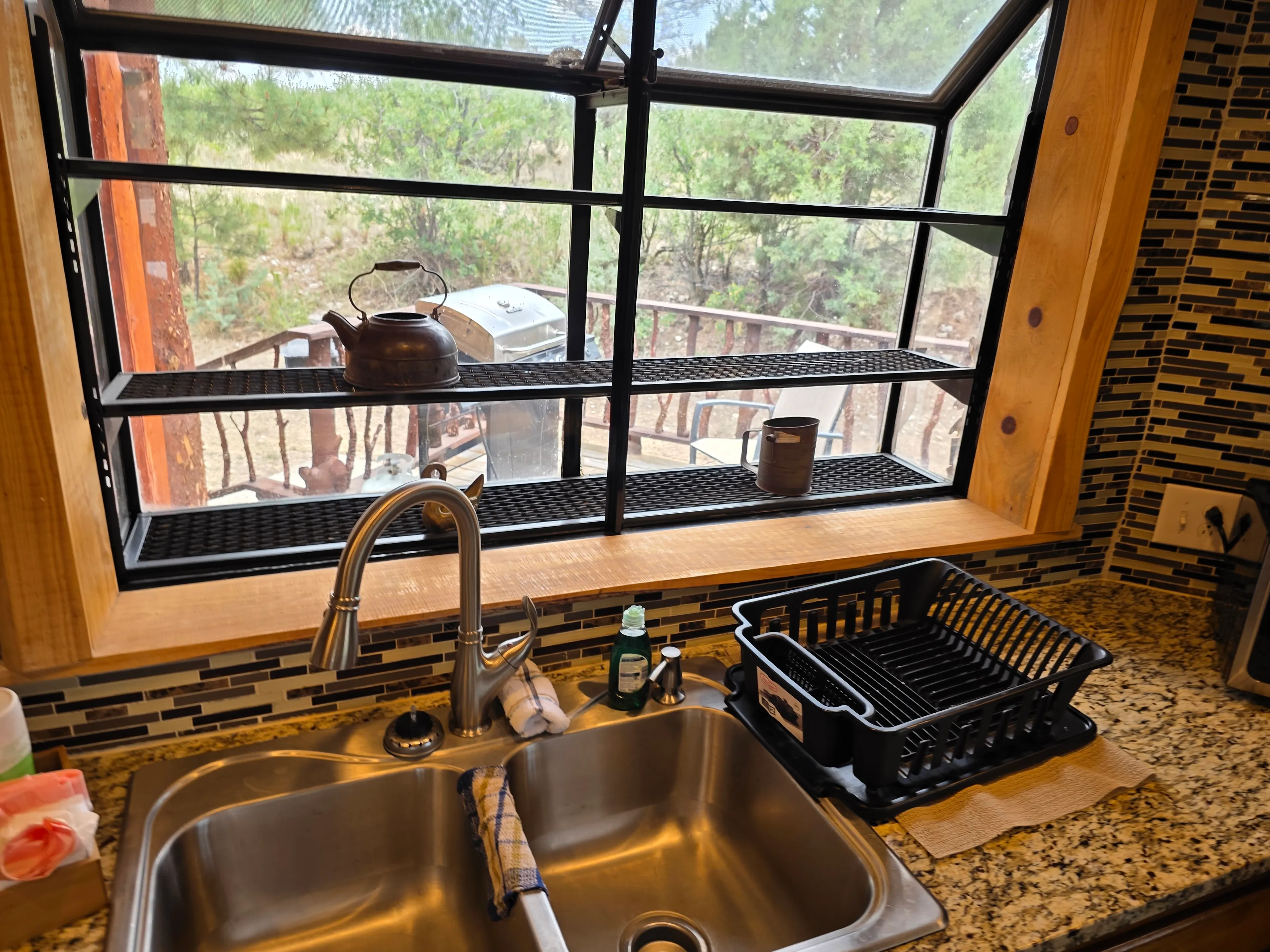 sink garden window with kettle