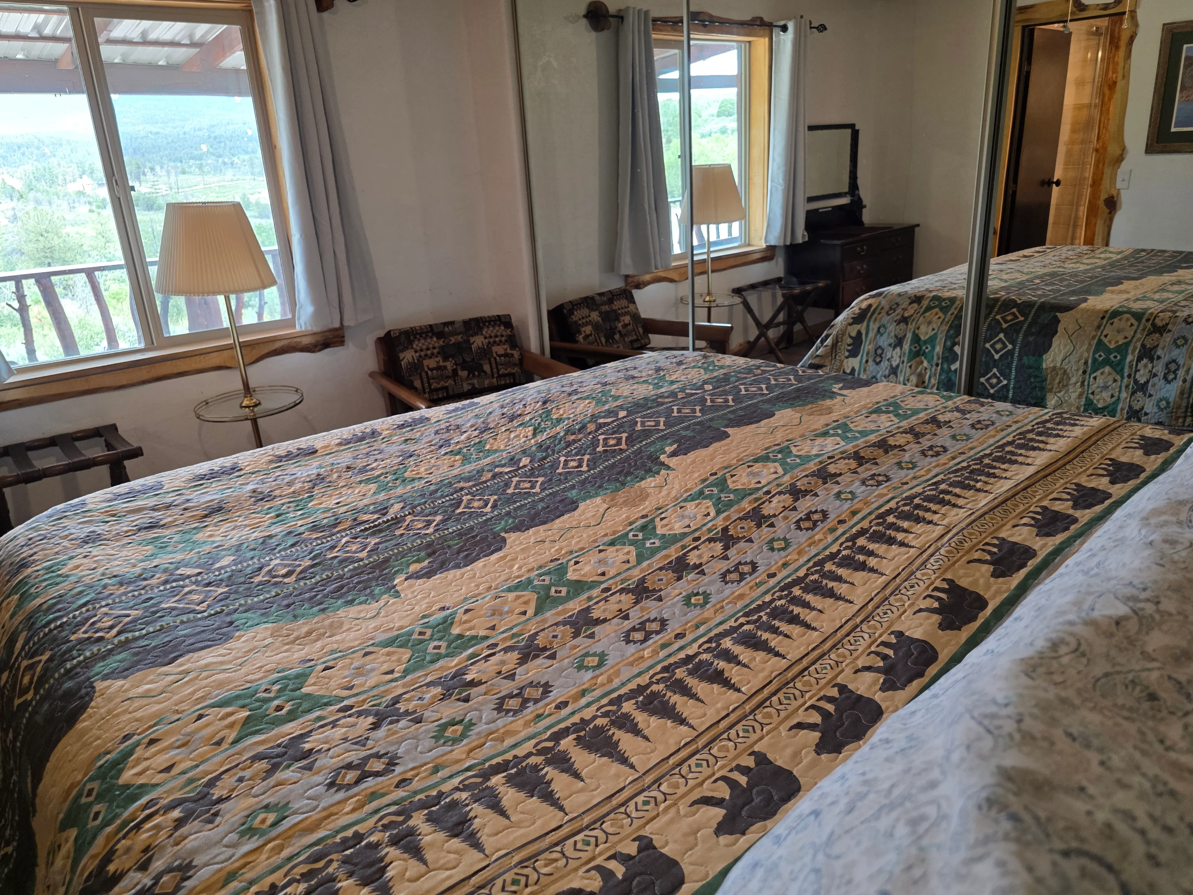 bear-quilt bed, forest view windows