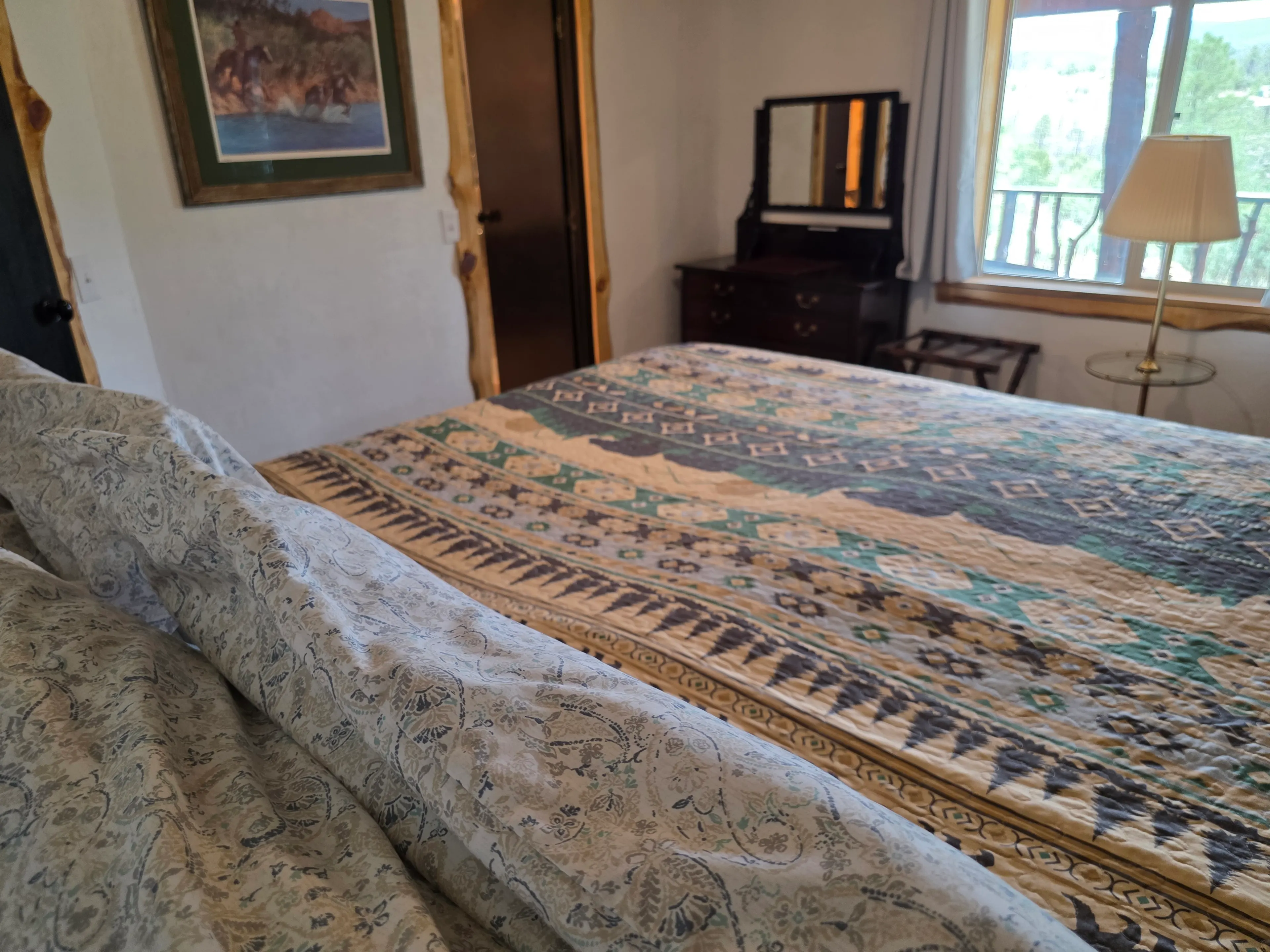 bed toward dresser and window