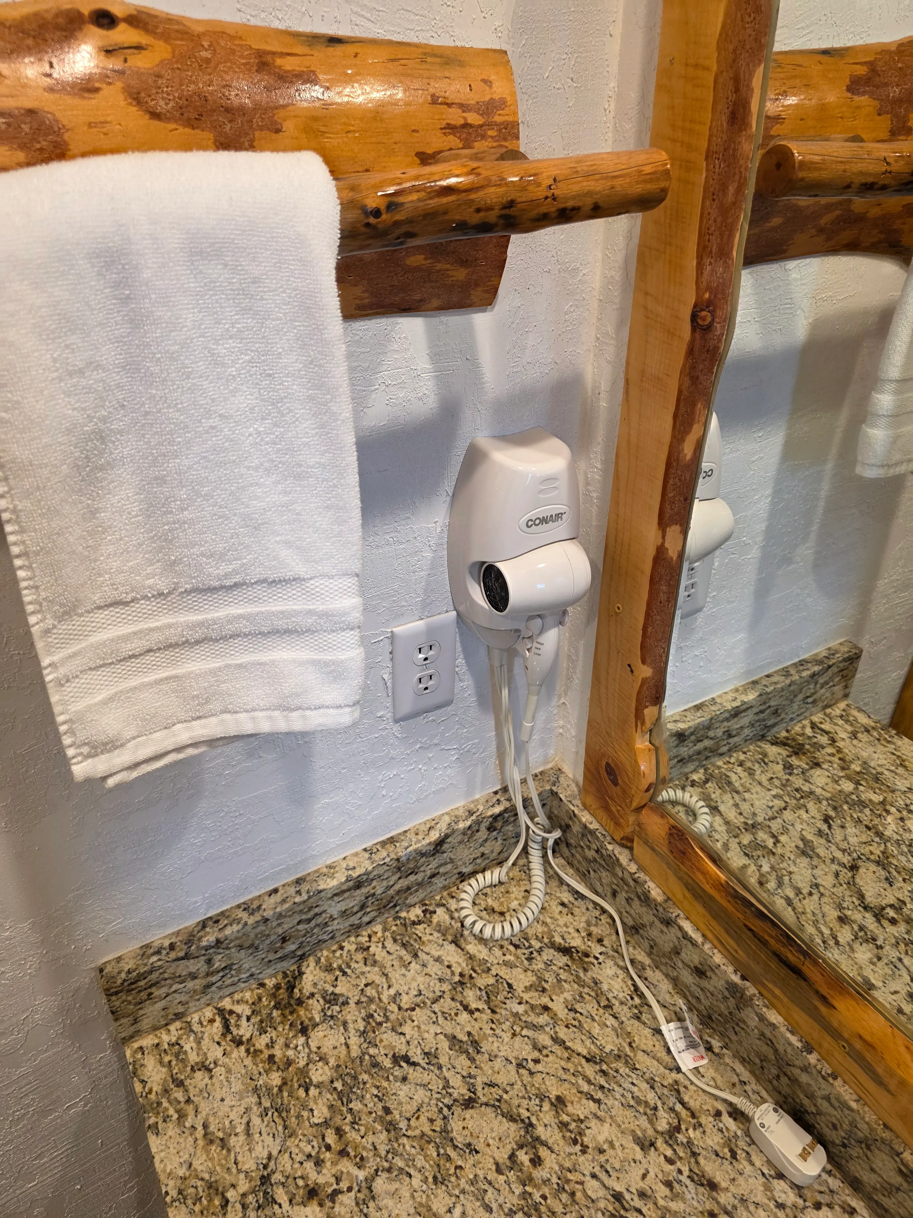 wall-mounted Conair hair dryer