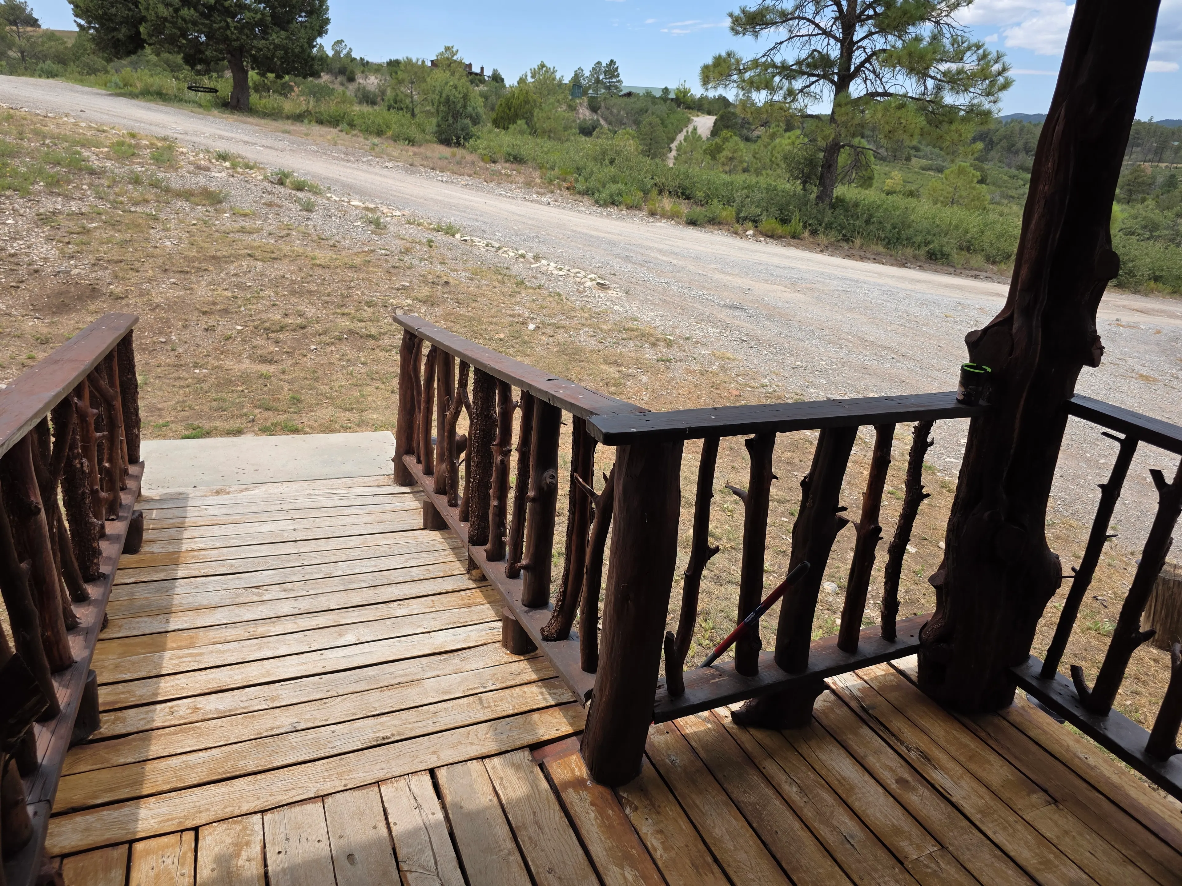 deck steps down to gravel drive