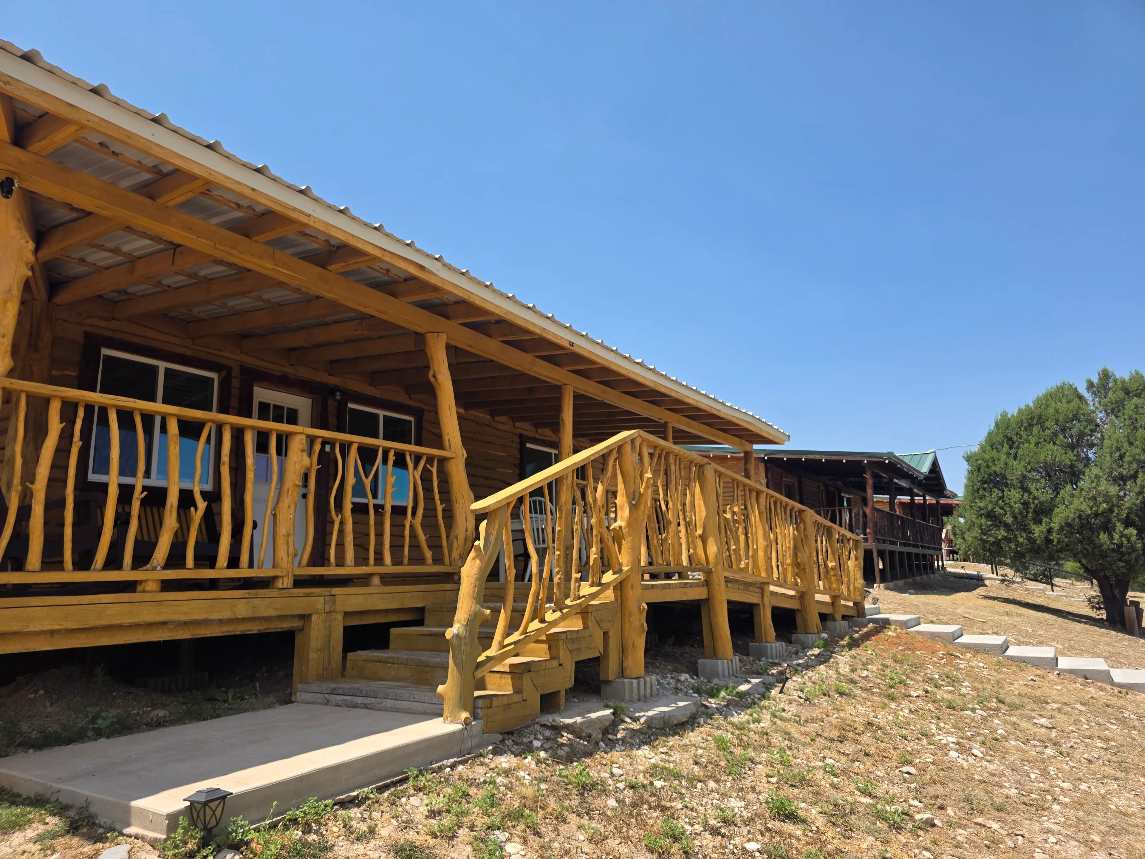 log cabin porch, rustic wood railings