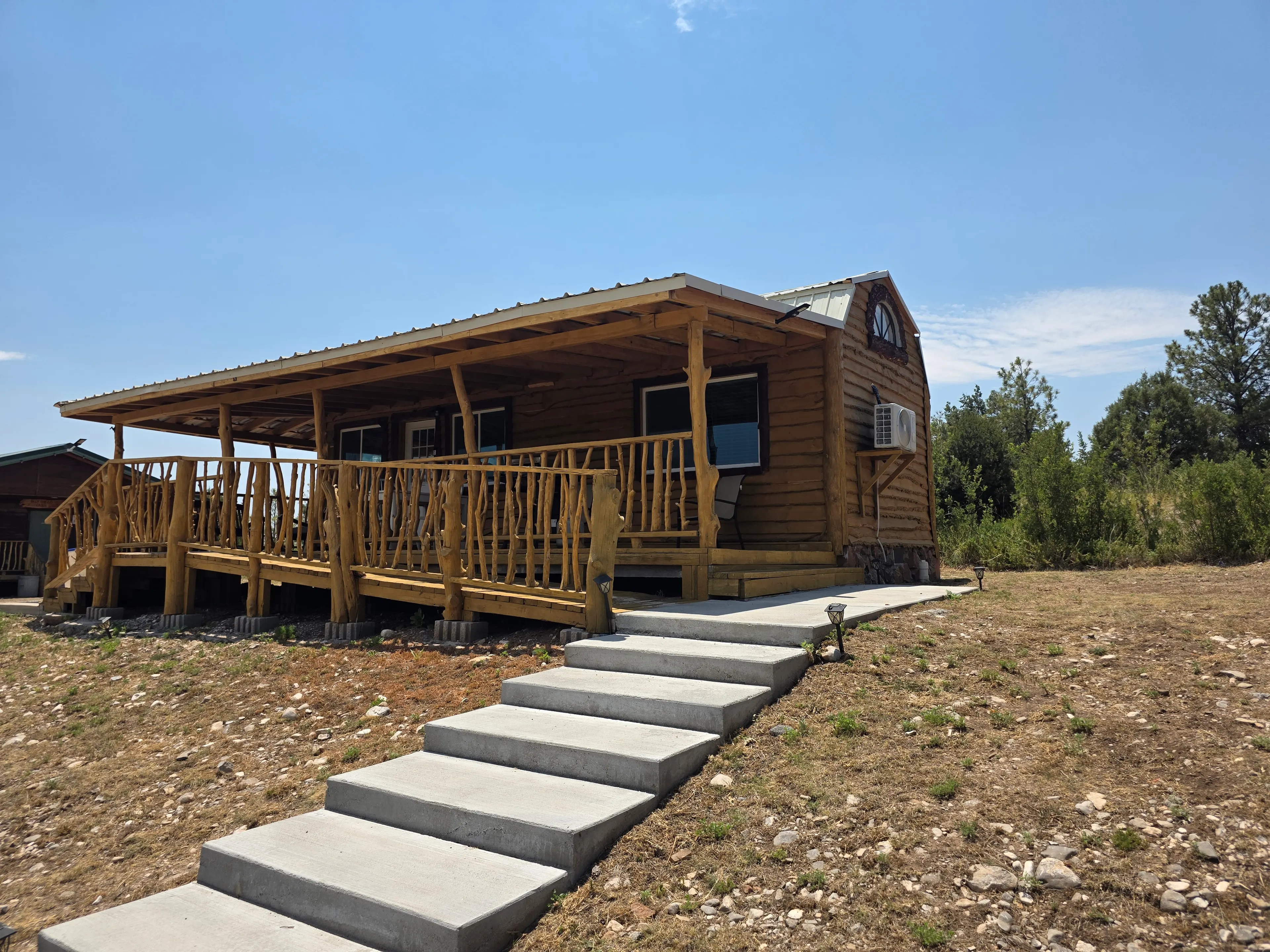 small cabin, concrete steps, mini split