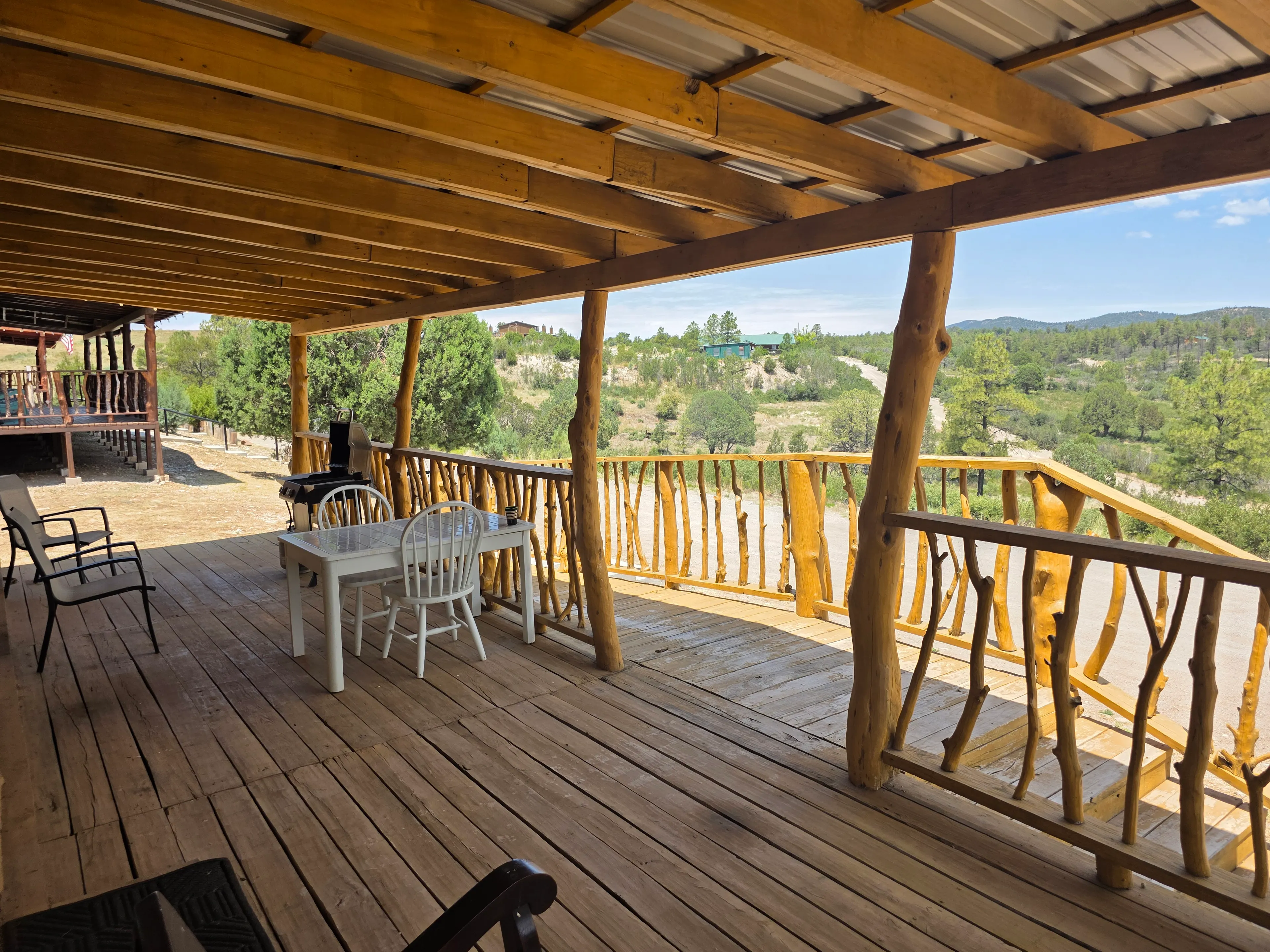 wide covered deck overlooking valley