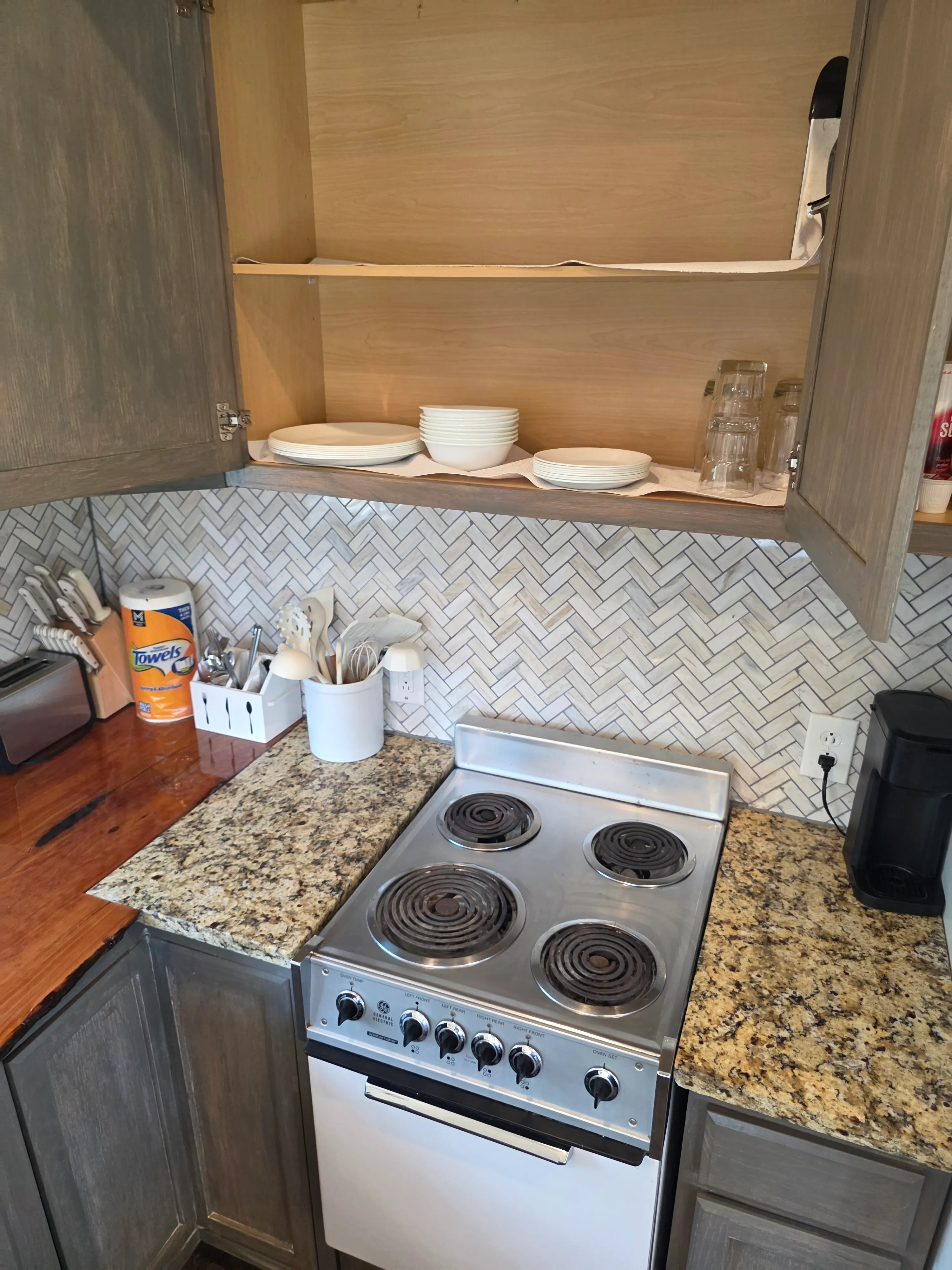 compact kitchen with electric stove