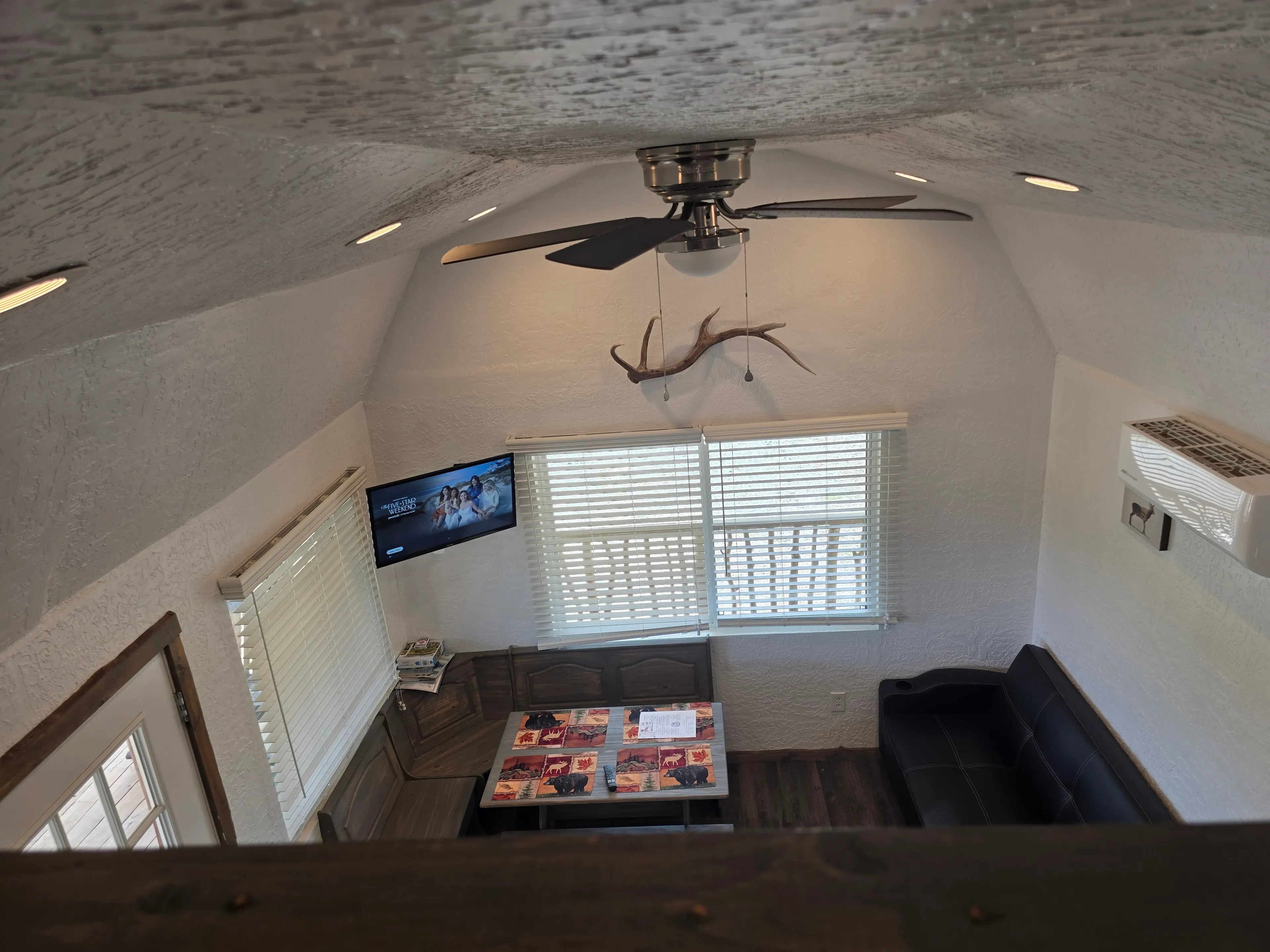 loft view of living dining area
