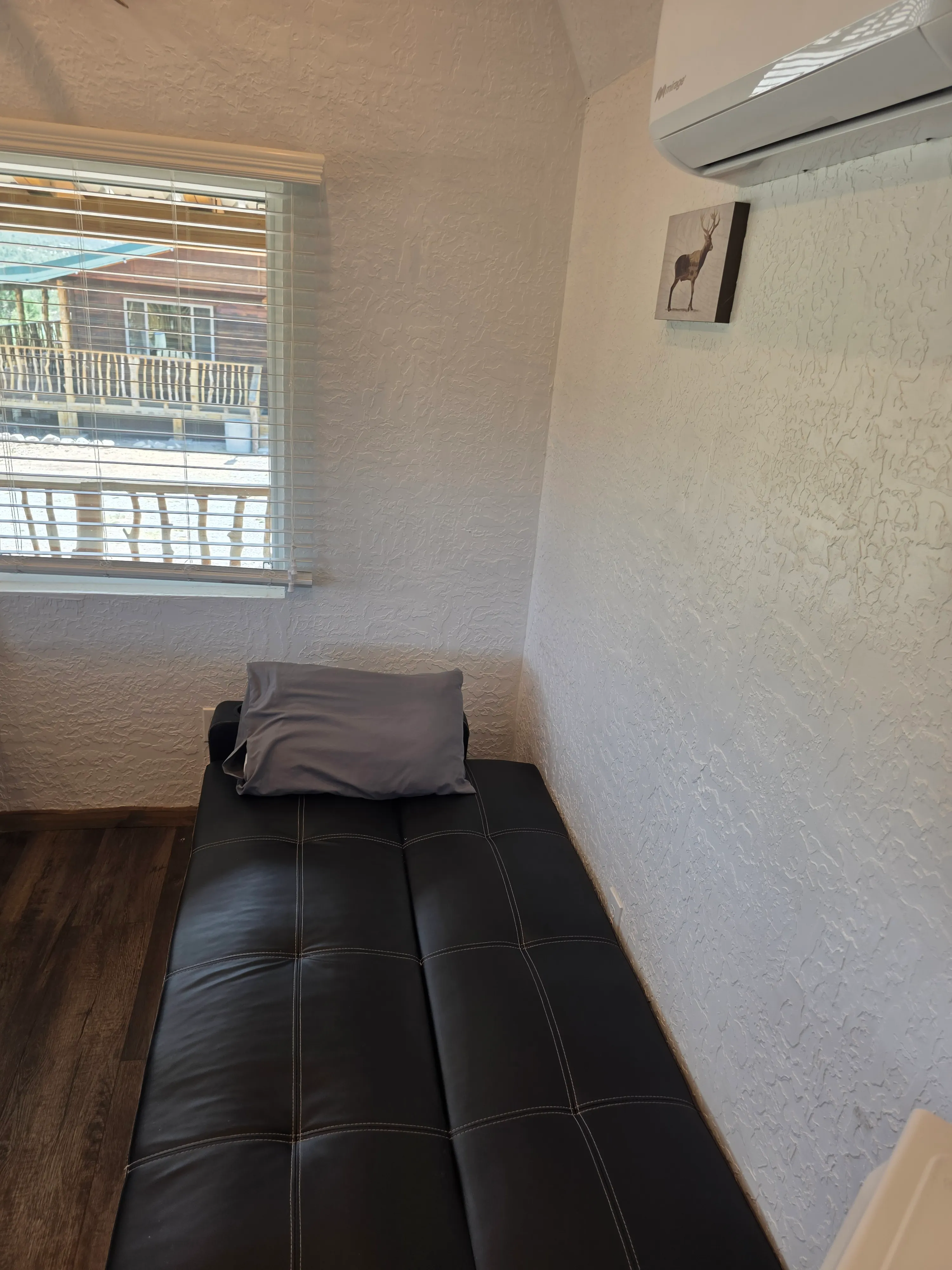 futon by window with view