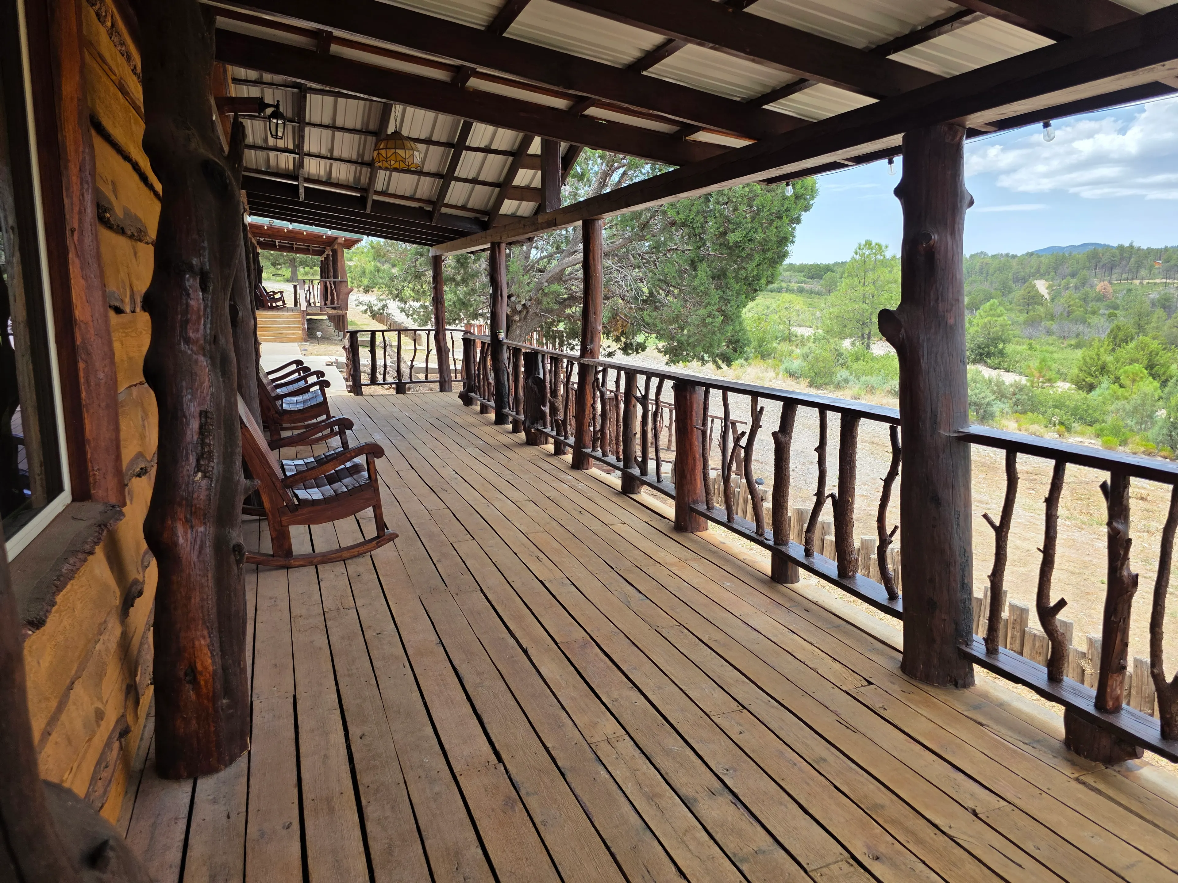 covered porch rockers and railing