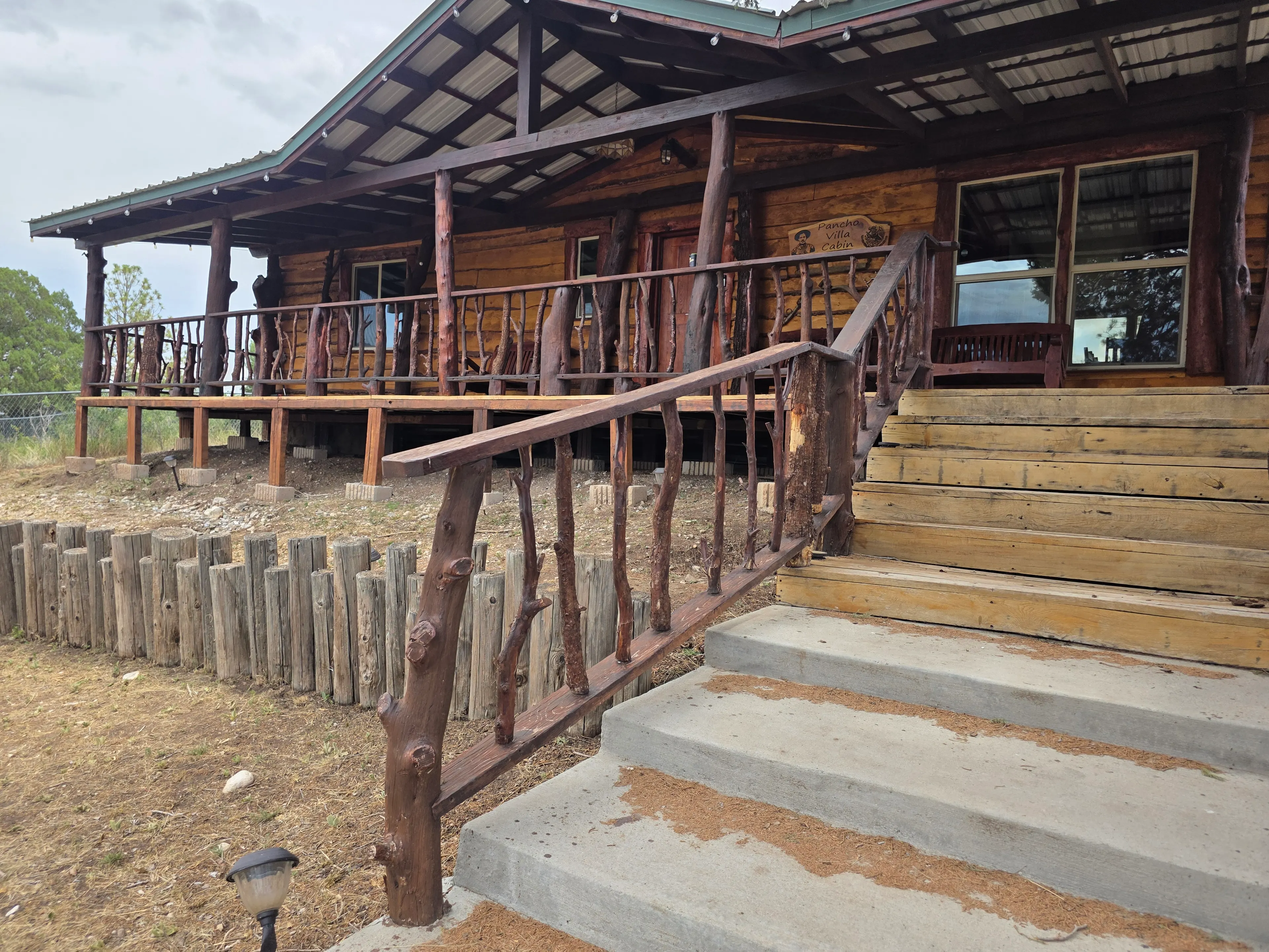 cabin front, steps, name sign