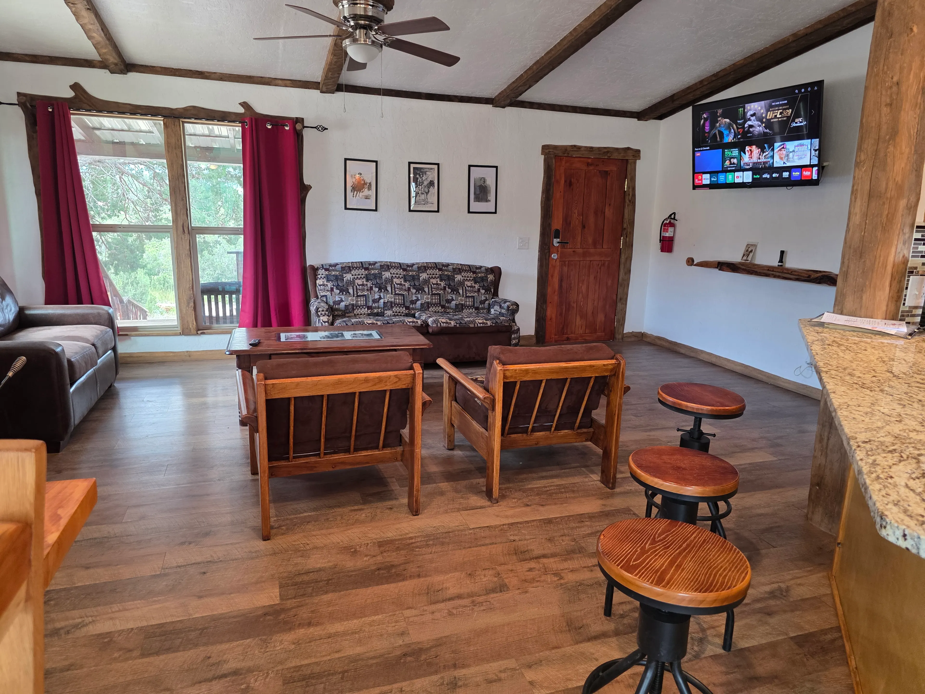 living room with wall-mounted TV