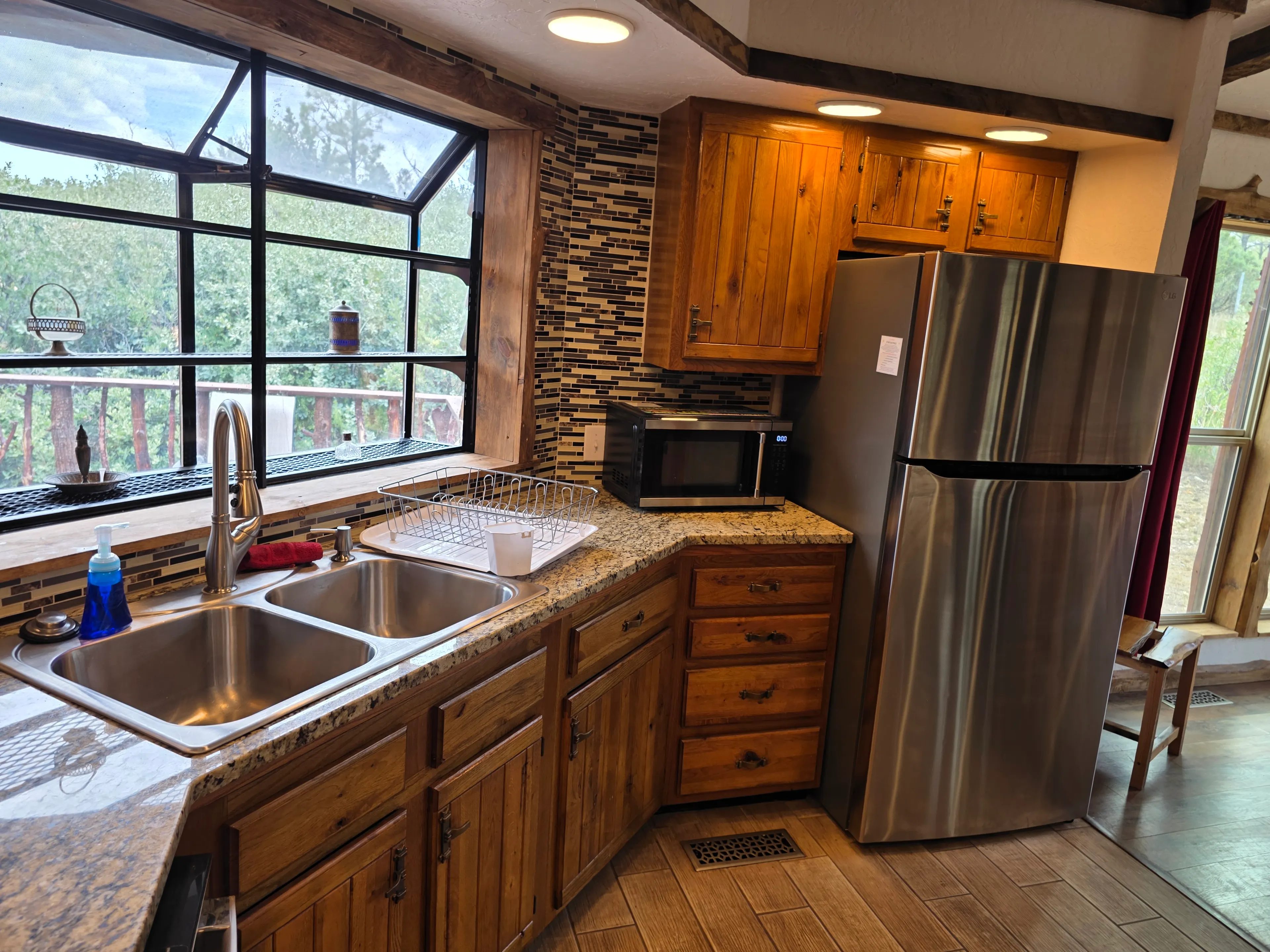 kitchen sink window and fridge