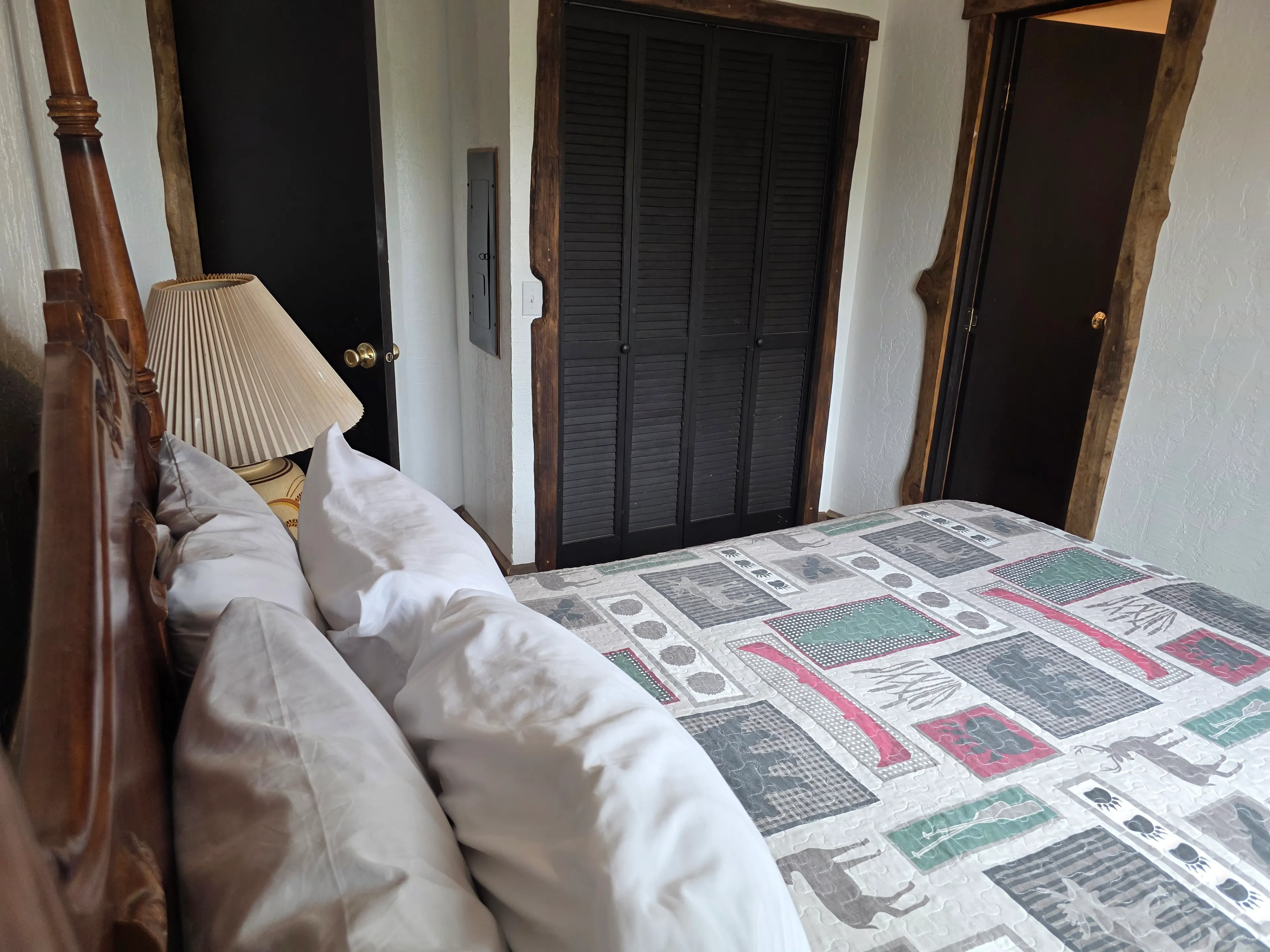 bed pillows and louvered closet