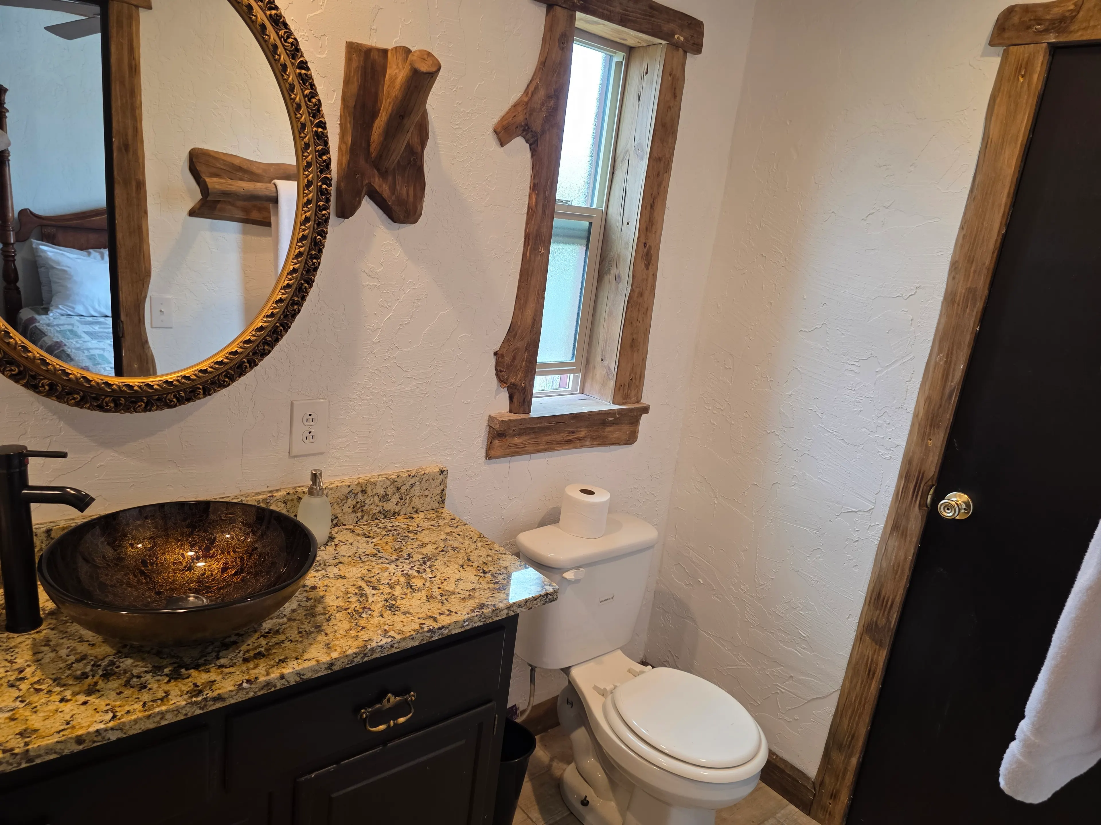 bathroom with glass vessel sink