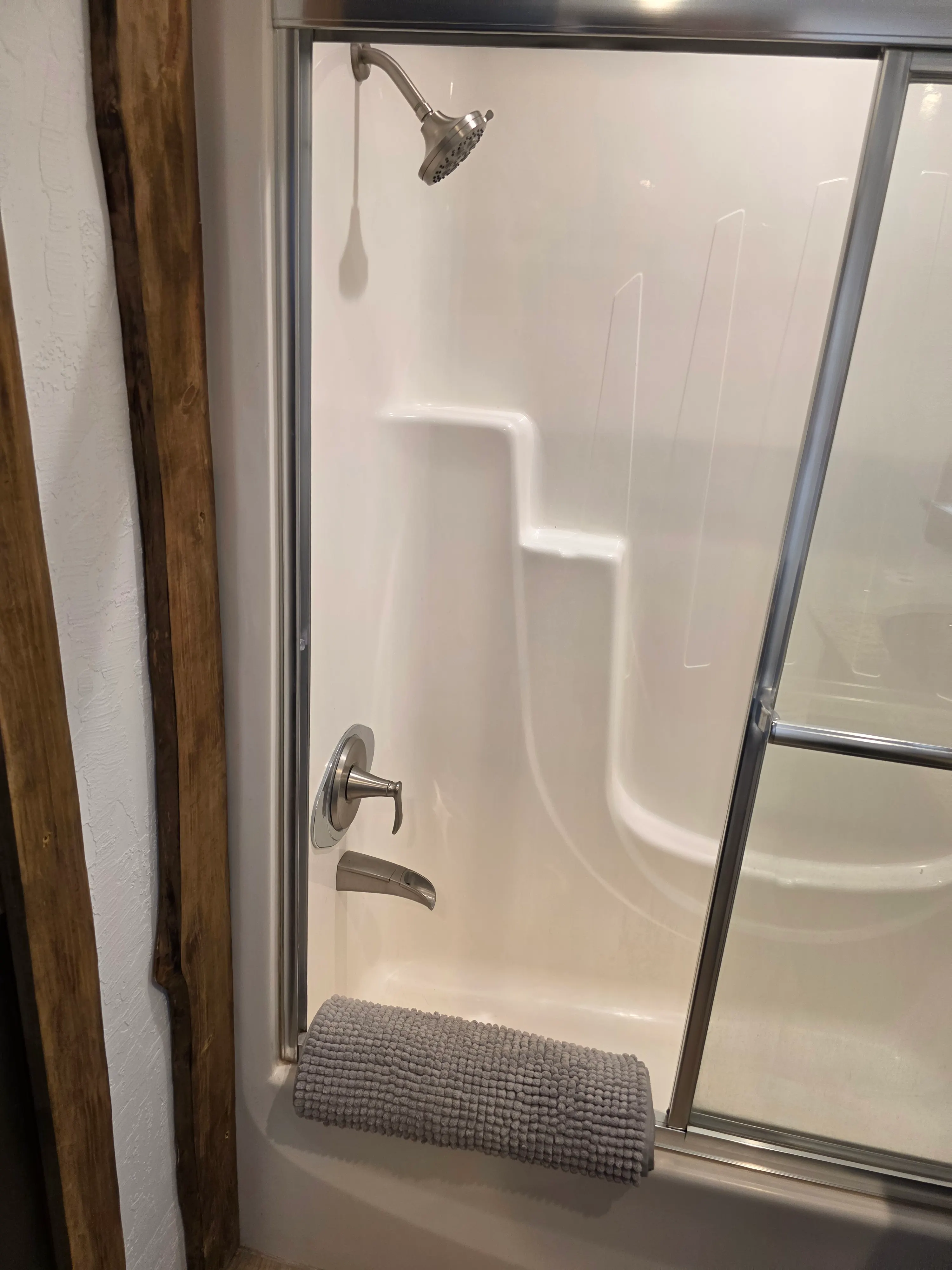 tub shower with glass doors