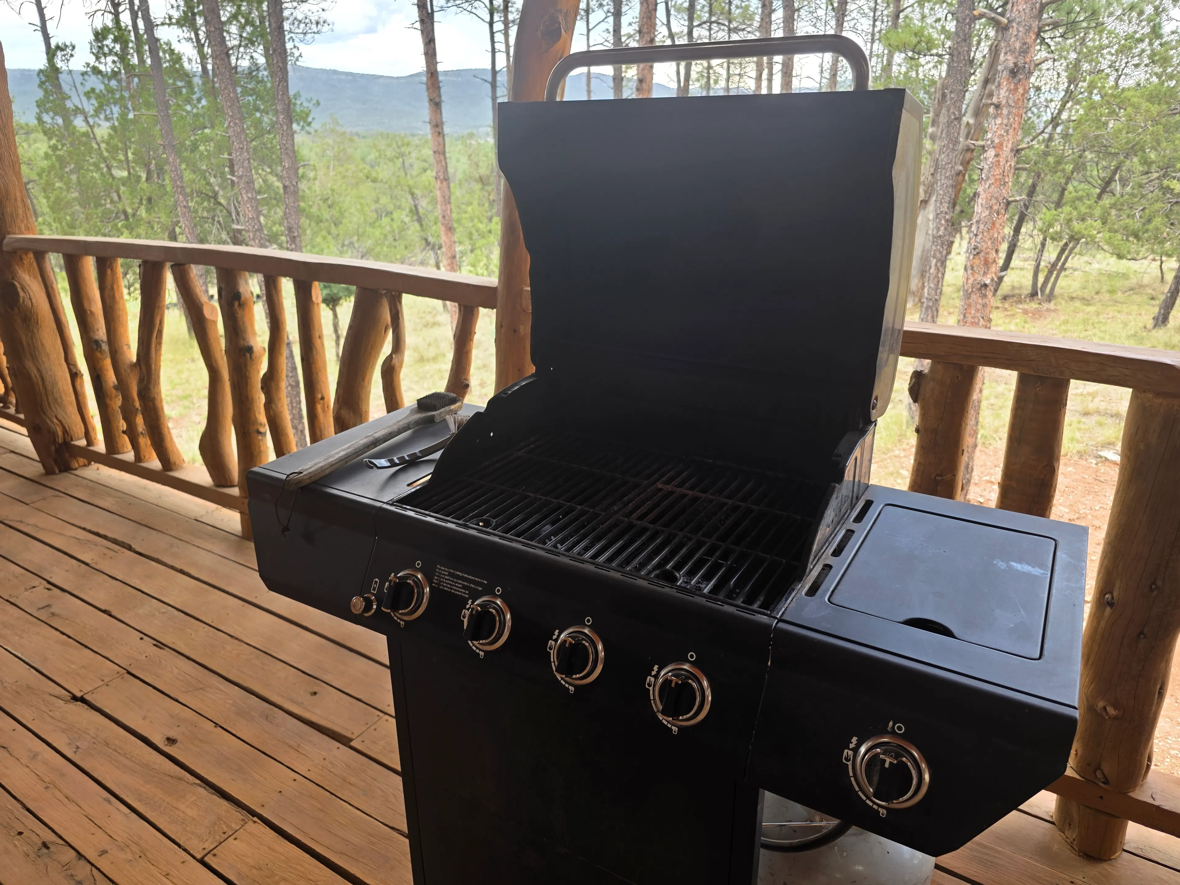 gas grill open on deck
