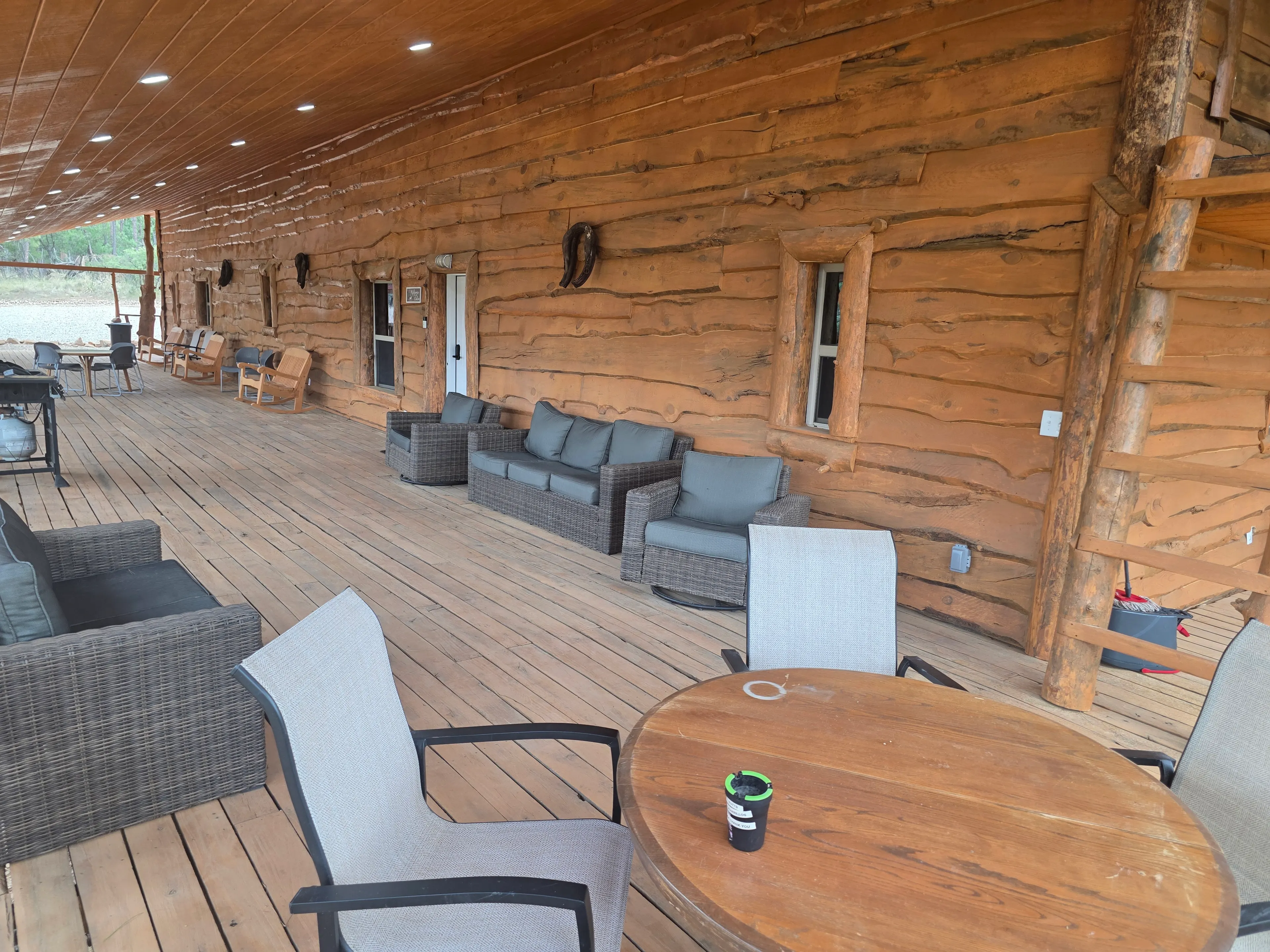 porch seating along log wall