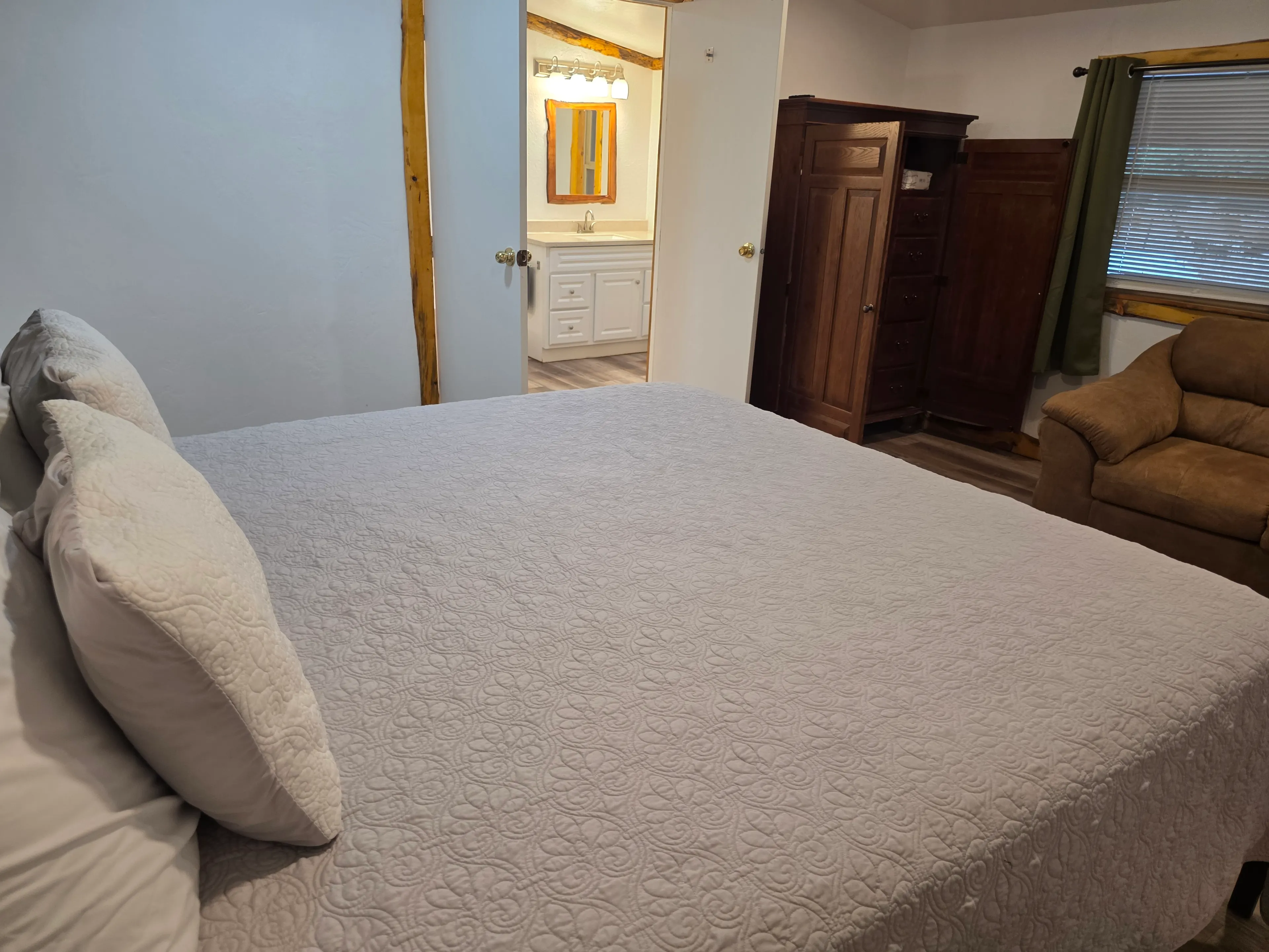king bed with ensuite bathroom view
