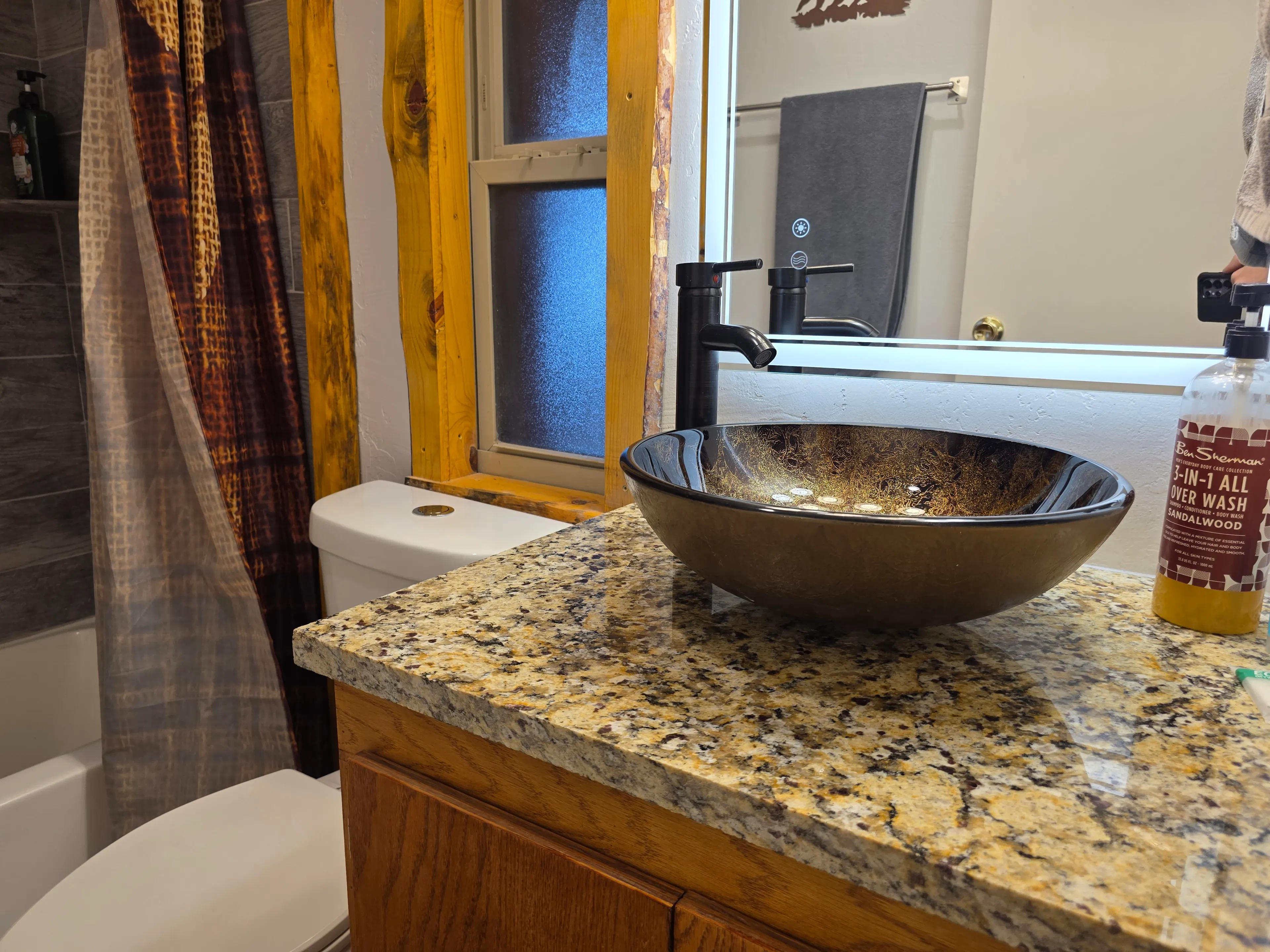 granite vanity with glass vessel sink