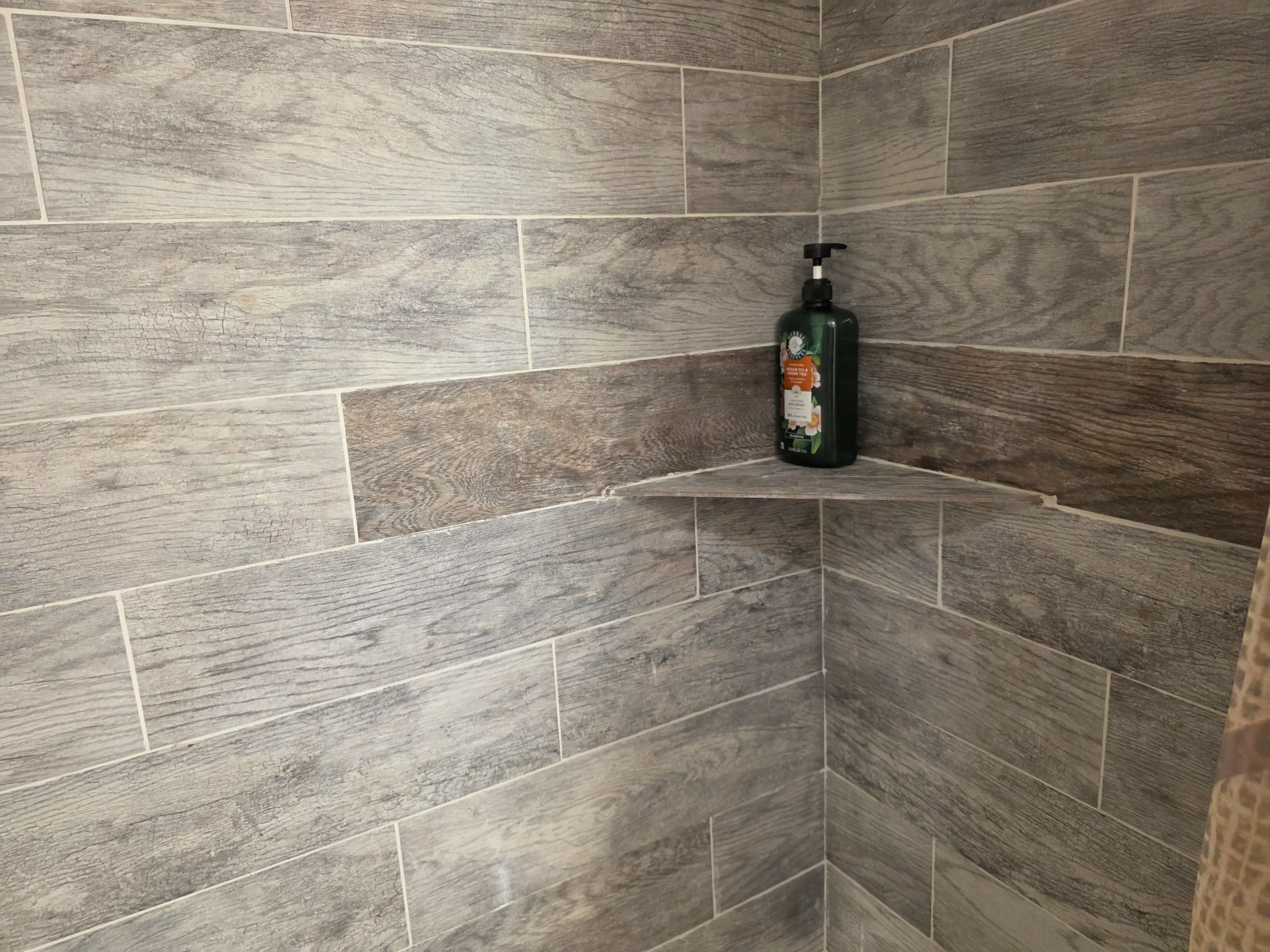 tiled shower corner shelf detail