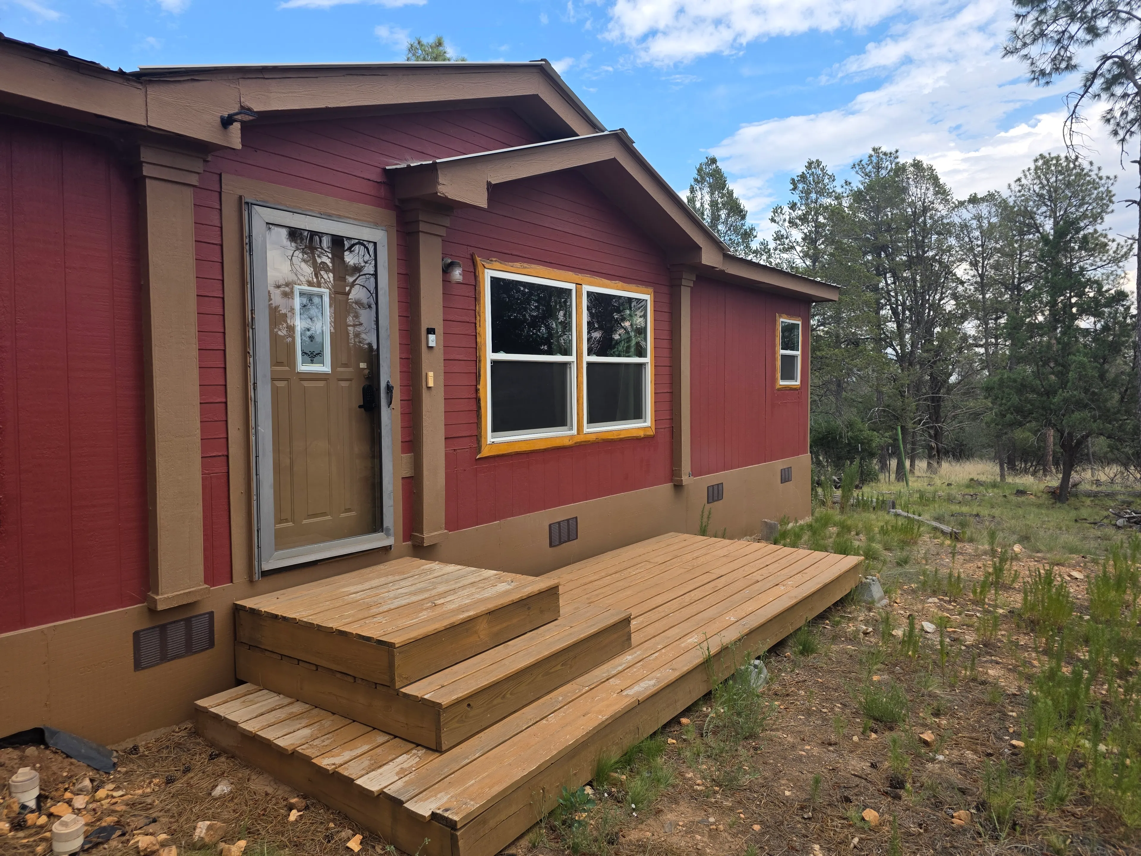 red cabin front entrance and steps