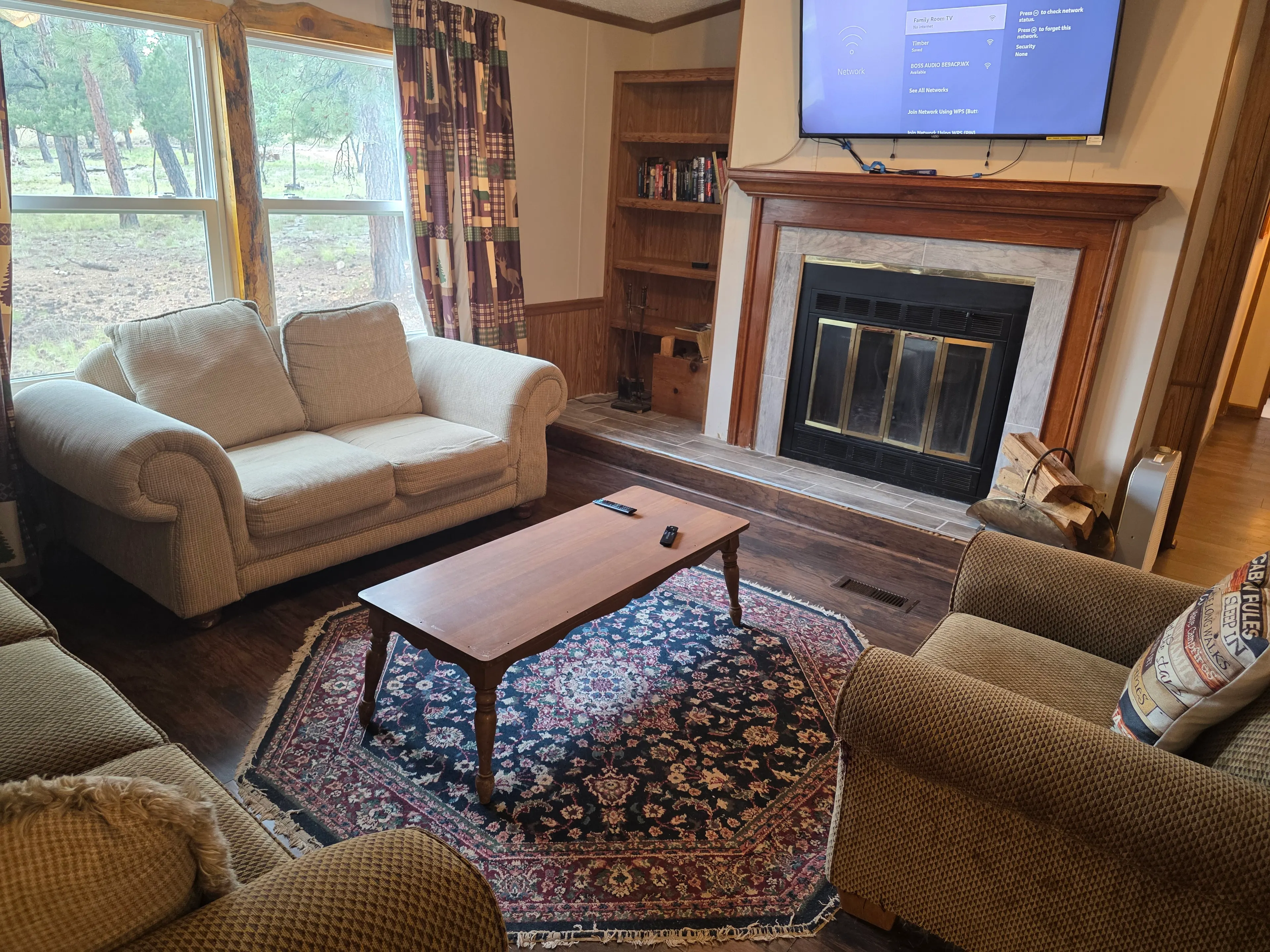 loveseats, fireplace, wall-mounted TV