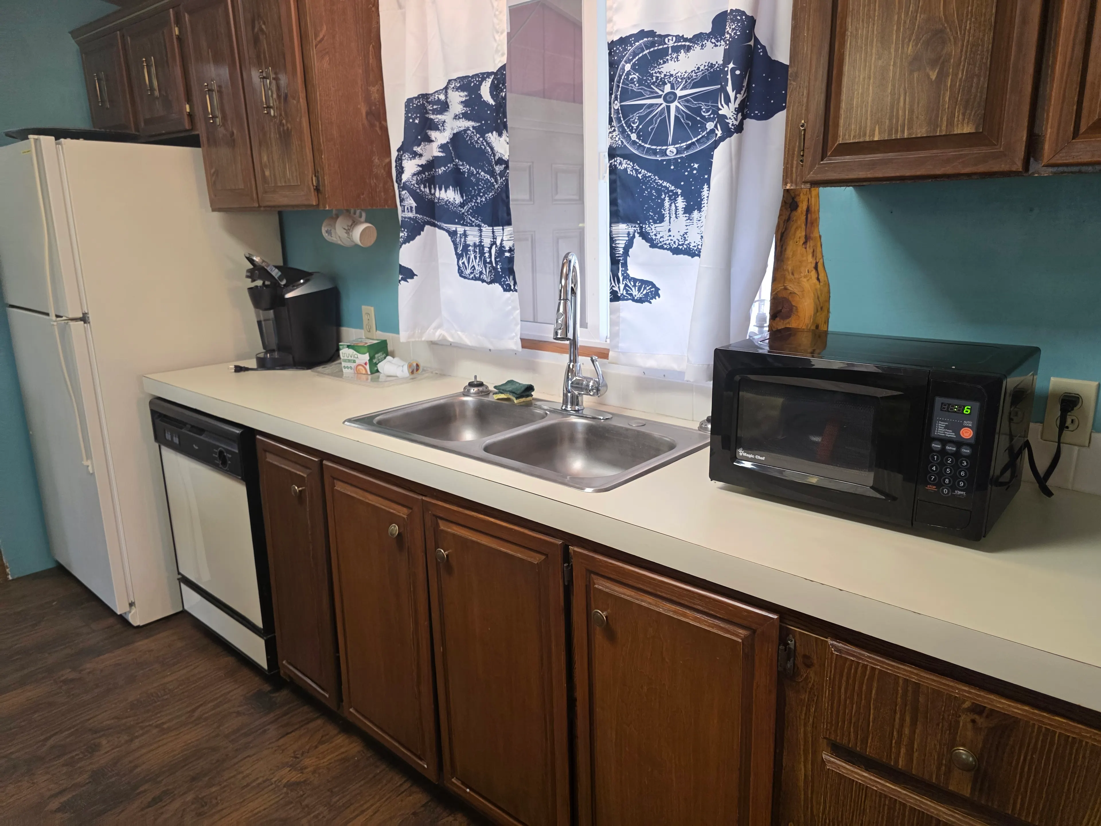 kitchen counter, sink and appliances