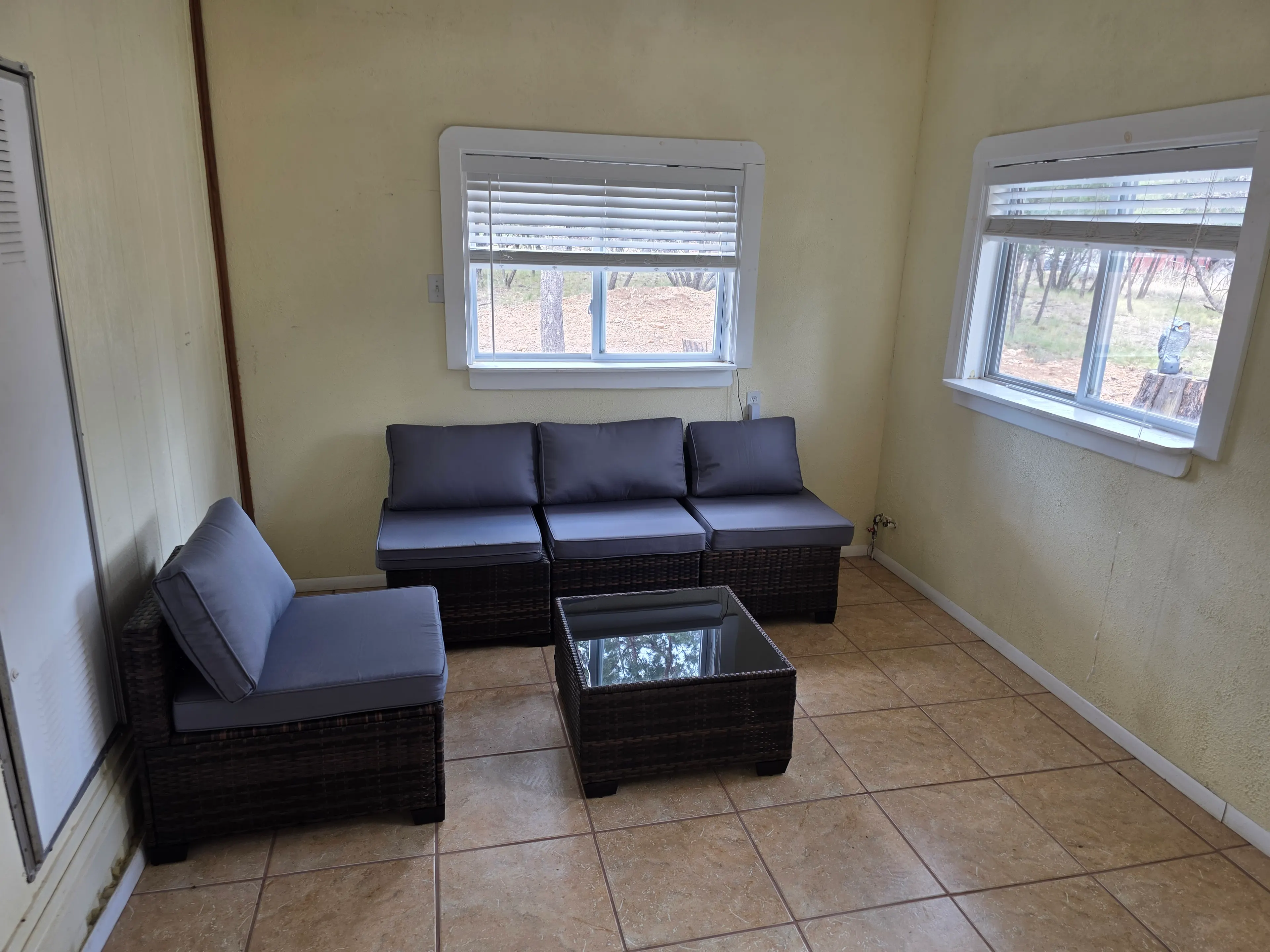 enclosed sunroom with wicker seating