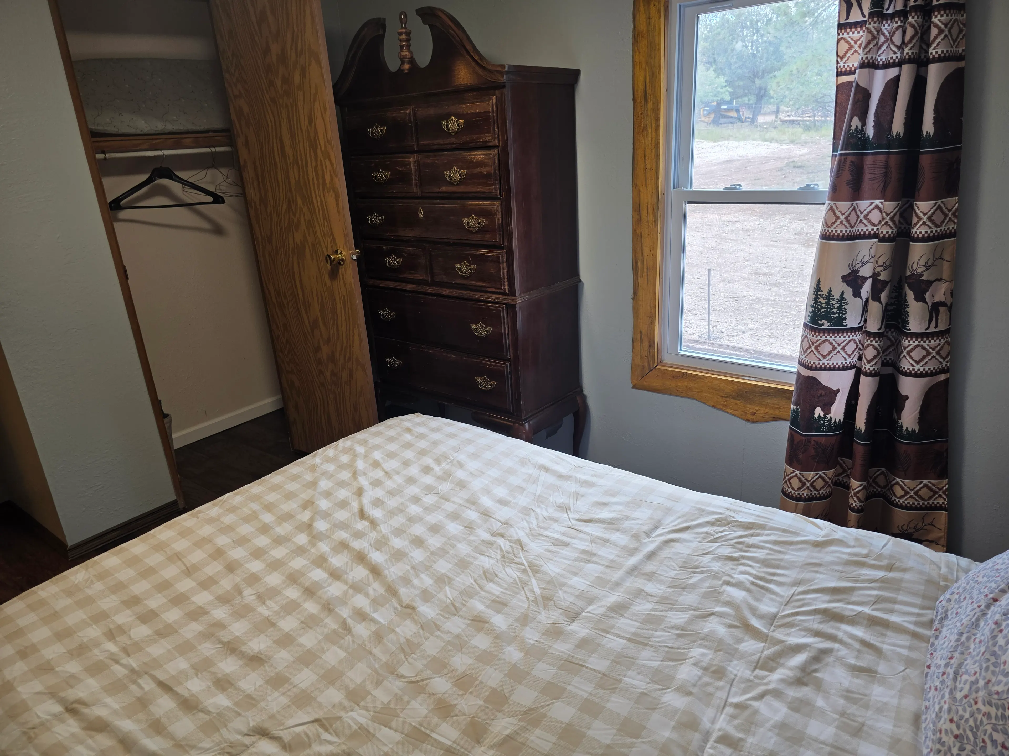 bedroom dresser and open closet